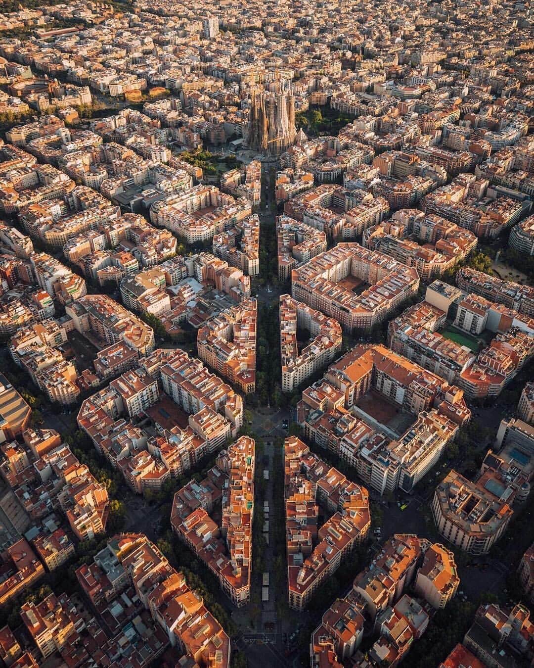 Canon Photographyさんのインスタグラム写真 - (Canon PhotographyInstagram)「The amazing street grid of Barcelona. This style of architecture is called Eixample and is characterized by long straight streets, a strict grid pattern crossed by wide avenues, and square blocks with chamfered corners.  Photography | @jacob  Canon 1dx mark II #barcelona #streetgrid #architecturephotography #helicopter #aerialphotography #spain #catalonia #sagradafamilia #gaudi」5月25日 1時26分 - cpcollectives