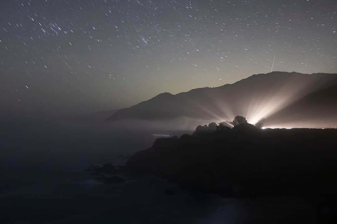 National Geographic Travelさんのインスタグラム写真 - (National Geographic TravelInstagram)「Photo by @mborowick | A long exposure photograph taken on Route 1 in California. As a car drives South, its headlights hit heavy fog causing this incredible moment to happen. Big Sur is home to some of the most beautiful scenic highway driving in the entire state. #california #bigsur #stars」5月25日 13時11分 - natgeotravel