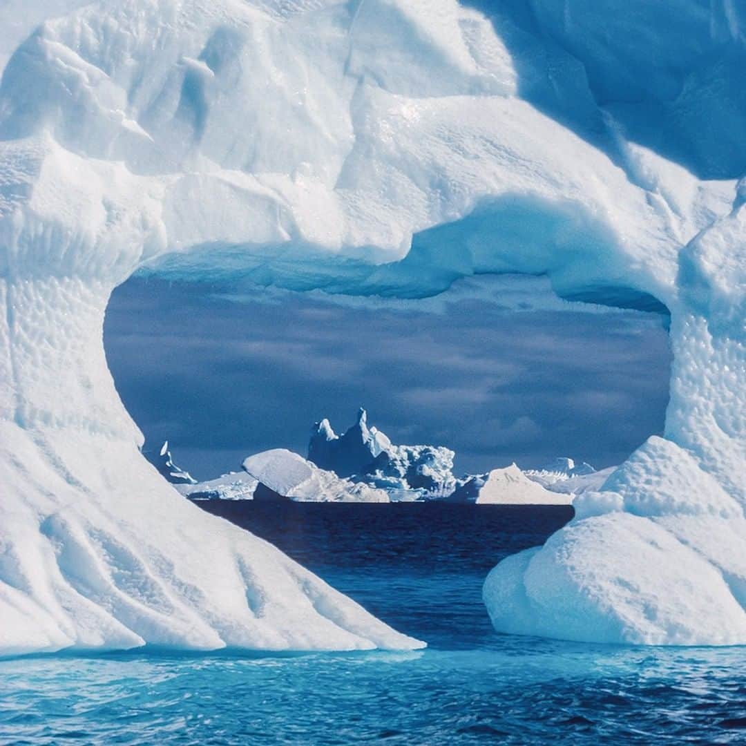 National Geographic Travelさんのインスタグラム写真 - (National Geographic TravelInstagram)「Photo by @DaisyGilardini | This image of an iceberg shaped as a heart is the picture I love the most in my collection. I took it during my first trip to Antarctica in 1997. To me, it is the most symbolic picture I’ve ever taken. That trip totally changed my life. I went from being an expert in finance and accounting to becoming a passionate conservation photographer. I always felt I left a piece of my heart on that trip to Antarctica. Ever since, I go back every year to check on it. Year after year, I’ve been documenting the changes and impact of climate change in such a delicate and important ecosystem. Follow me @DaisyGilardini for more images and stories behind the scenes. #Antarctica #landscapephotography #iceberg #climatechange」5月26日 16時02分 - natgeotravel