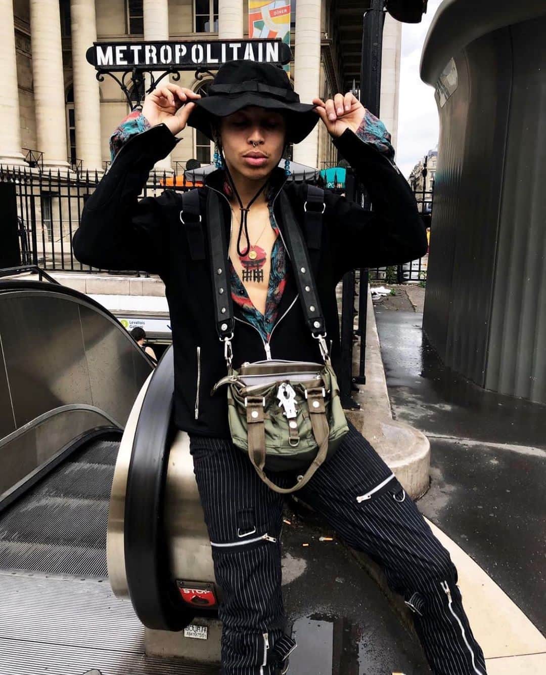ジョージジーナ&ルーシーのインスタグラム：「From Paris with love 🦋 @gothboikenny with is our “Evil Cique - olive“ • • • • #gglsquad #georgeginalucy #streetwear #streetstyle #streetfashion #hypebae #hypebeast #hsstyle #highsnobiety #style #malemodel #menswear #mensfashion #braids #braider #bag #accessories #35mm #justgoshoot #paris #frace #ootdmen #ootd #outfit #septum #piercing」