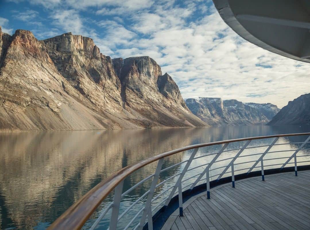 National Geographic Travelさんのインスタグラム写真 - (National Geographic TravelInstagram)「Photo by @acacia.johnson | Granite cliffs rise from the sea in Sam Ford Fjord, a remote fjord on northeast Baffin Island in the Canadian Arctic. A traditional hunting area for the Inuit people – who have inhabited this region for thousands of years – this dramatic fjord has also gained popularity with rock climbers. Follow me at @acacia.johnson for more adventures from the Arctic and beyond. #baffinisland #nunavut #samfordfjord #canadianarctic」5月27日 22時07分 - natgeotravel