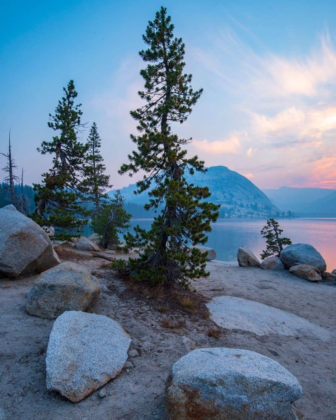 National Geographic Travelさんのインスタグラム写真 - (National Geographic TravelInstagram)「Photo by @KristaRossow | Last summer, I went to Yosemite National Park on assignment with a high school photography expedition, where we photographed sunrise at Tenaya Lake. Haze created by the nearby Ferguson Fire made soft pastel colors in the morning sky. To see more photos from my travels, follow me @KristaRossow. @NatGeoExpeditions #natgeostudentexpeditions #Yosemite #sunrise」5月4日 1時02分 - natgeotravel