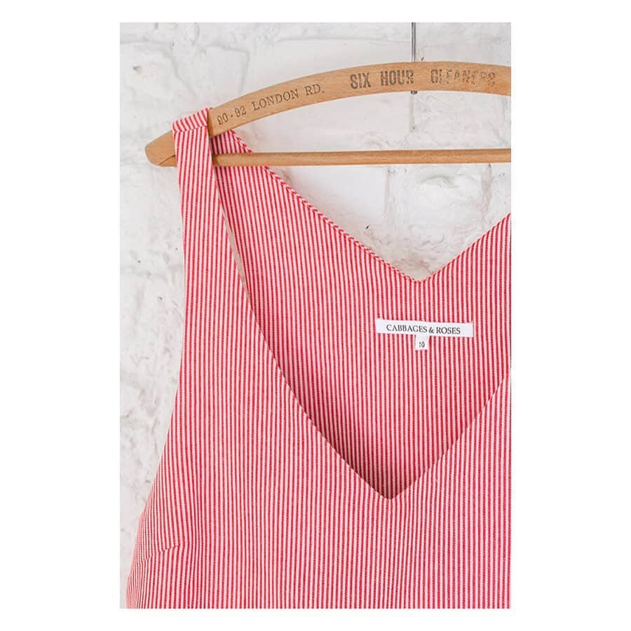 キャベジズ&ローゼズのインスタグラム：「Sweet and neat, the newly arrived Veronica Dress has a deep V-neck collar that is the perfect compliment to one’s décolletage #newnew #redandwhite #candystripes #slowfashionstyle #vneck #vneckdress #britishmade #sustainablefashion #cabbagesandroses #cabbagesandrosesfashion @christina_strutt @cabbagesandroses_shop 👆Link In Bio👆」