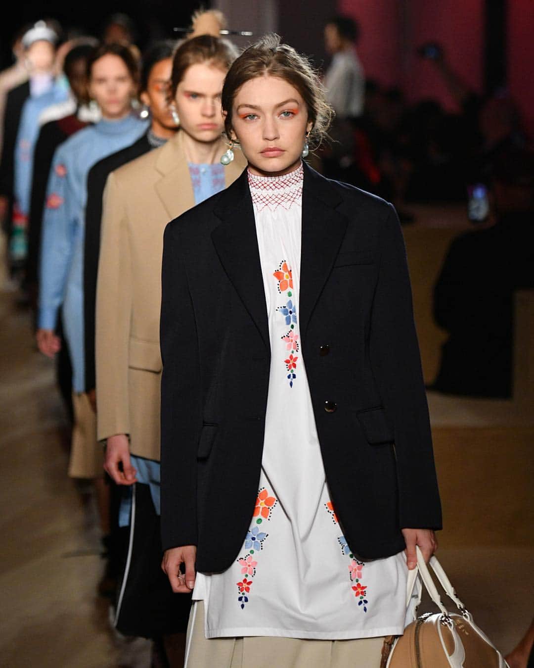 Fashion Weekのインスタグラム：「On the runway at @prada's Cruise 2020 show, #MiucciaPrada kept it lowkey with stripes, check patterns, and florals evoking a chic and simply '70s vibe. 👈 See #GigiHadid, #KaiaGerber, and more walk the #Prada runway in New York City. Photography by @gettyimages」