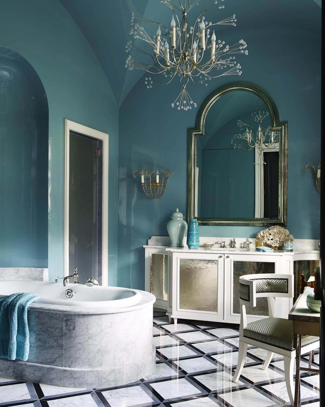 ELLE DECORさんのインスタグラム写真 - (ELLE DECORInstagram)「Deep turquoise is our new favorite shade for the bathroom. The tub in the master bath of this Paris apartment is by Jacob Delafon, with fittings by Waterworks, the sconces are by Niermann Weeks, and the Veere Grenney chair is covered in an Armani/Casa fabric; the chandelier is by Tony Duquette, and the vanity, mirror, and marble flooring are all custom designs. Design by @jeanlouisdeniot, photography by @simonuptonphotos, from the ED archive.」5月5日 7時10分 - elledecor