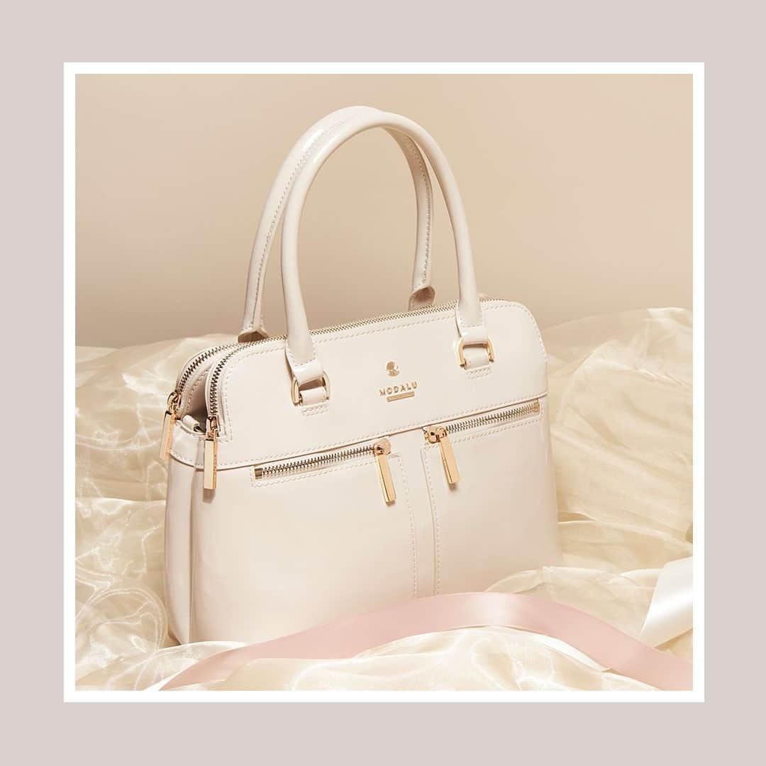 のインスタグラム：「Perfectly suited to Spring, the cream patent Pippa combines elegance and luxury effortlessly. Was £79, now £24 #ModaluMoments #Handbags #London」