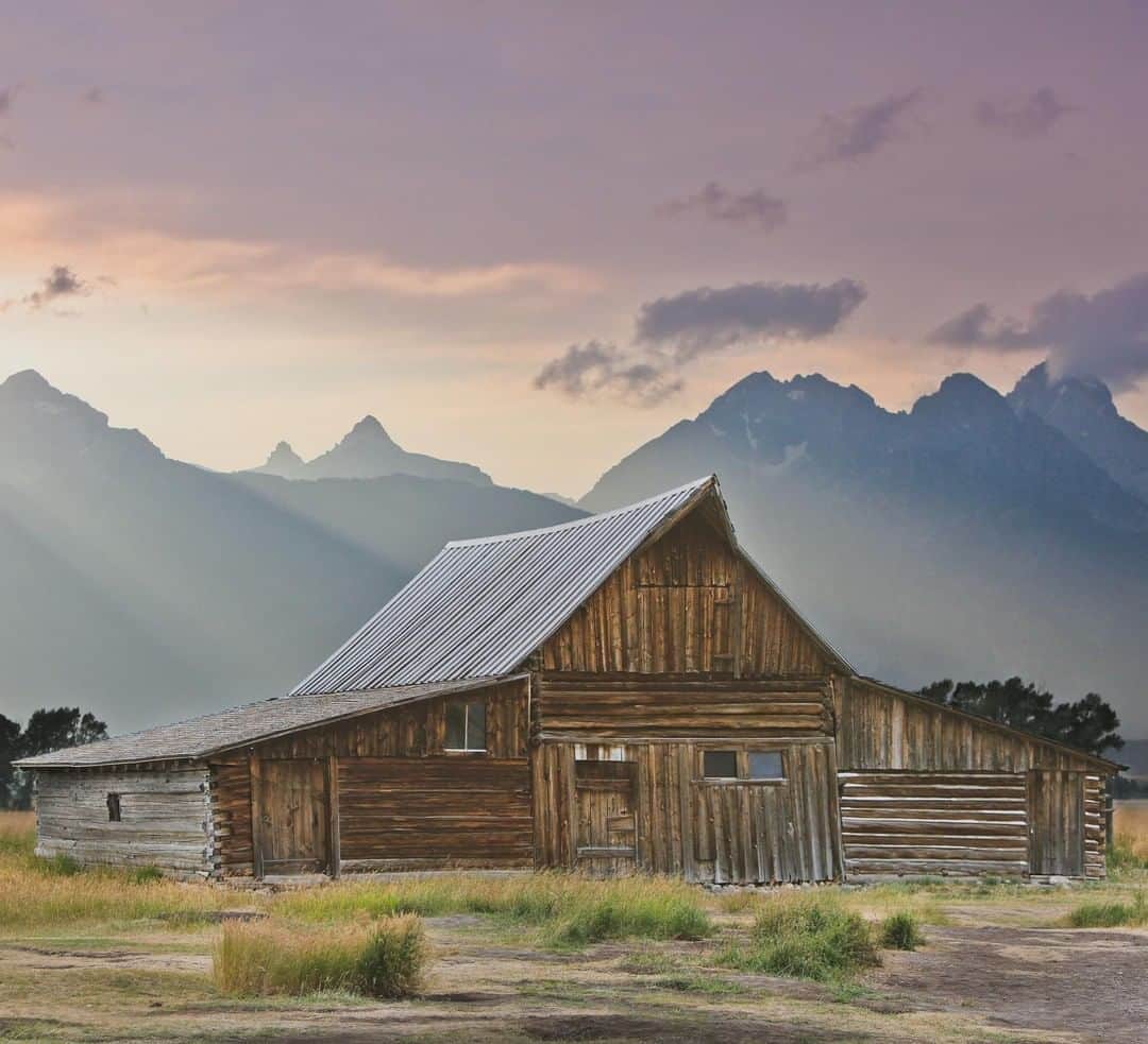 Lonely Planetさんのインスタグラム写真 - (Lonely PlanetInstagram)「'We were just about to leave, disappointed in the cloud filled skies during sunset, when suddenly the sun peaked through and golden rays poured out from behind the mountains. Mormon Row at Grand Teton National Park is one of the most photographed spots in the park. The Moulton Barn set against the jagged edges of the #Tetons was built in the early 1900s, and is a great spot to visit at sunrise or sunset.' – @localadventurer -- That's a wrap for this weekend's #lpinstatakeover! Check out @localadventurer for more of Esther and Jacob's shots! #USA」5月6日 2時00分 - lonelyplanet