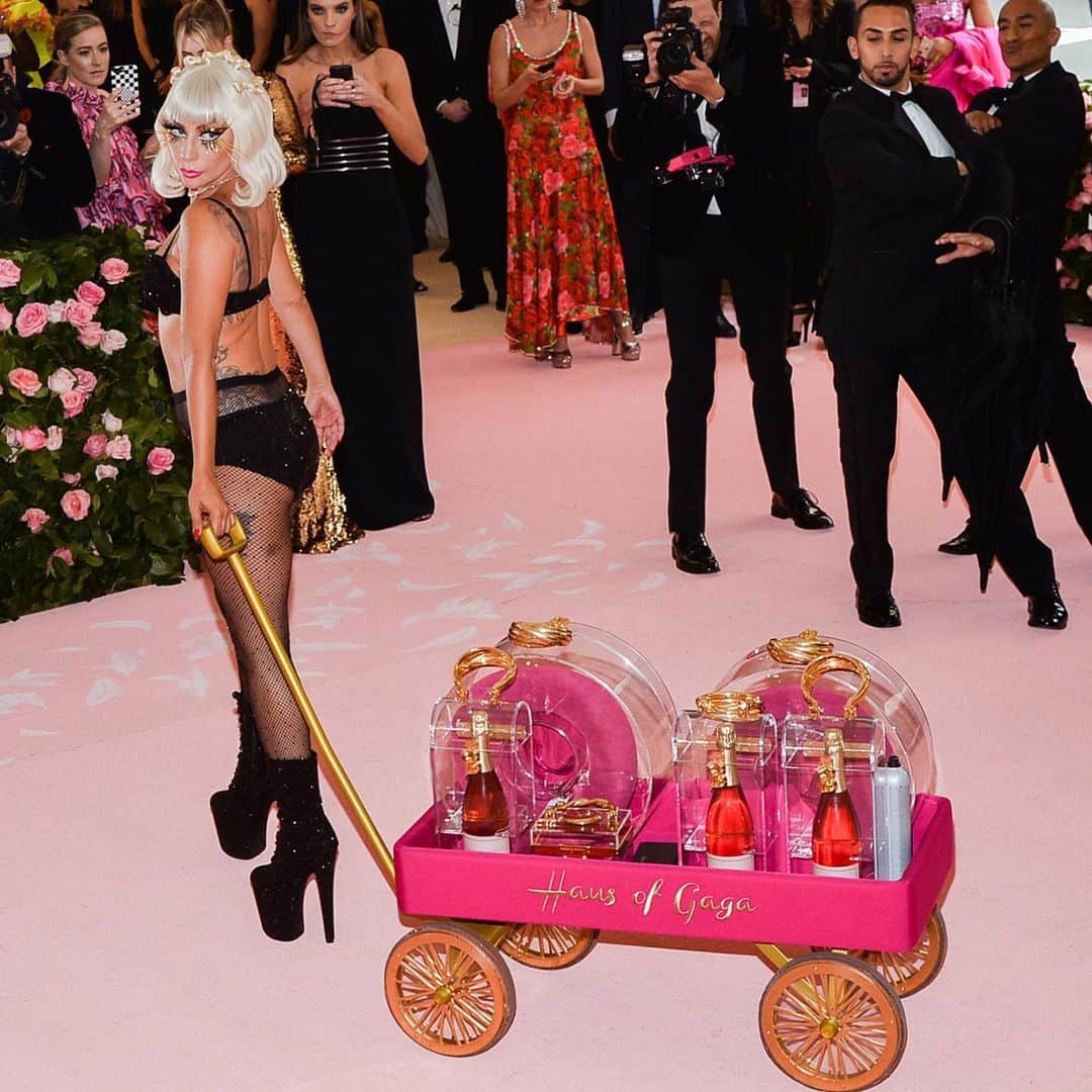 TIME Magazineさんのインスタグラム写真 - (TIME MagazineInstagram)「@ladygaga is no novice when it comes to making a statement. Her entrance on May 6 at the #MetGala, where this year's theme is Camp: Notes on Fashion, was no different. For many, embracing over-the-top may be out of their comfort zone. But for Gaga, resplendent in her @brandonmaxwell gown, it was an opportunity for performance art. With Maxwell's help, she removed her voluminous cape dress (which had a 25-foot train) to reveal a second look, a vampy corseted black dress. She upped the ante by changing into a hot pink column gown, which she wore with a pair of sunglasses. A fourth look involved a crystal bra, undergarments and pantyhose. Gaga, one of the night's hosts, commanded the #pink carpet with a regality that comes from years of embodying the camp aesthetic, on and off the stage. Photographs by @kevintachman—MG19/@gettyimages; Anthony Behar—@sipausa/@apnews (3)」5月7日 8時42分 - time