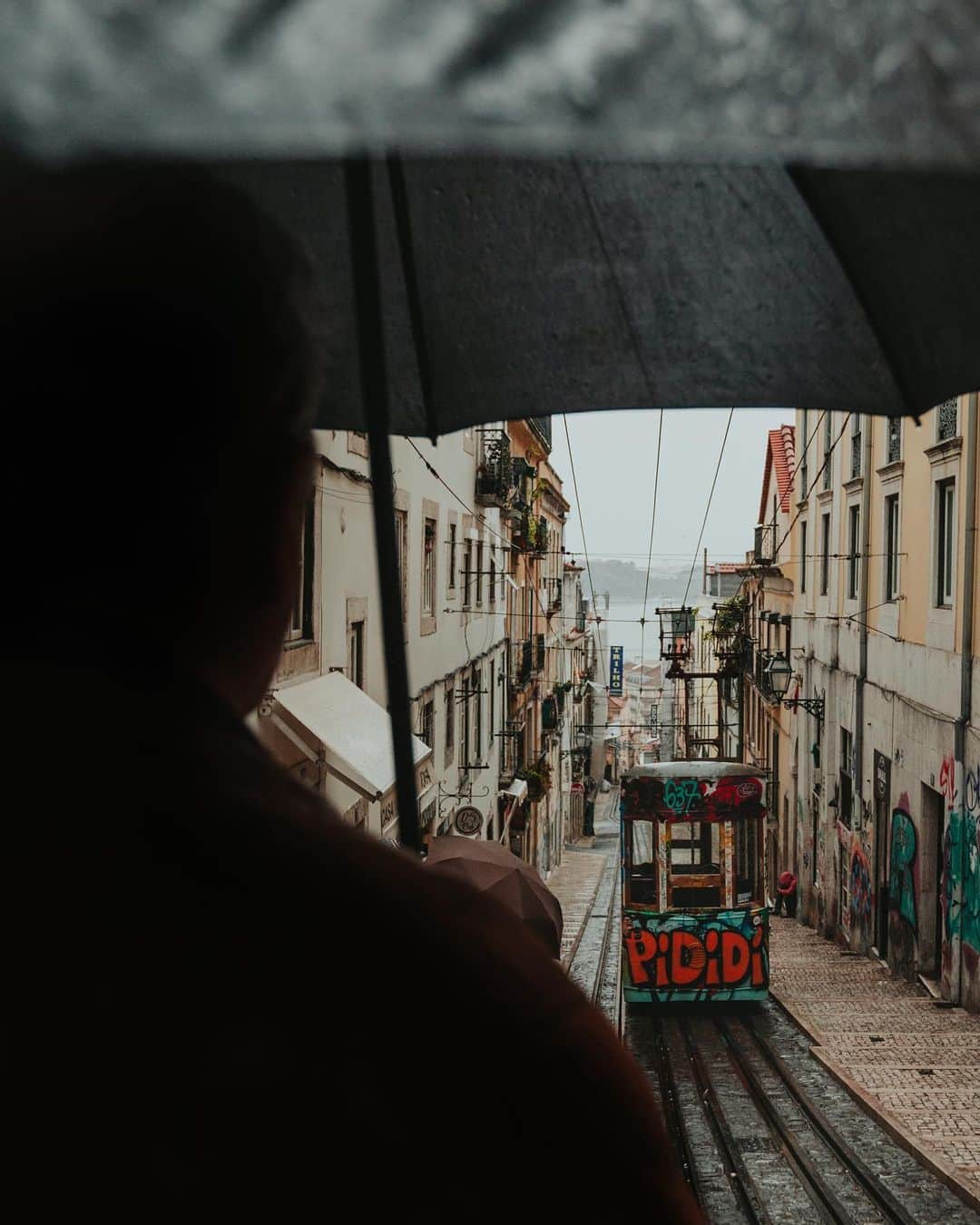 Putri Anindyaさんのインスタグラム写真 - (Putri AnindyaInstagram)「Lisbon rainy day scenes // a week ago I browsed thru my hard disk and it came to a realisation that I have so many Lisbon pictures that I haven’t shared here. It was a wonderful day despite of the heavy rain that never stopped. Me and @capra311 were wandering around with raincoat and little umbrella that we brought from Paris. I can’t complain because i’m a lover of the rain especially in a extraordinary place like this. Let me know which slide is your favorite! :) Song video : Cela? by Graham Reynolds」5月7日 19時34分 - puanindya