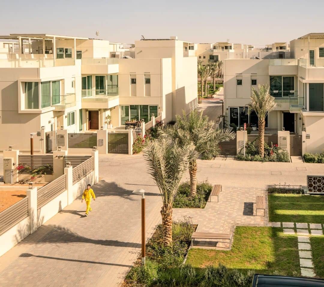 National Geographic Travelさんのインスタグラム写真 - (National Geographic TravelInstagram)「Photo by @lucalocatelliphoto | On Dubai’s southern outskirts, a new housing development has opened—called Sustainable City—that recycles its water and waste and produces more energy than it consumes thanks to solar panels that shade roof terraces and parking lots. Building orientation was a critical design choice at the Sustainable City, where homes face north and shade each other. A decade ago Dubai had one of the largest ecological footprints of any city in the world. By 2050 it wants to have the smallest. Can it get there? My work revolves around the making of the future, how our society transitions through new ways of living, and how technology is changing our approach to the environment and to our cities. I’ve embarked on a journey with @natgeo to showcase how Dubai aims to become one of the world’s greenest cities. Follow me @lucalocatelliphoto to find out more about the Dubai story I covered for @natgeo #Dubai #environment #architecture #sustainability #people #city」5月8日 4時15分 - natgeotravel