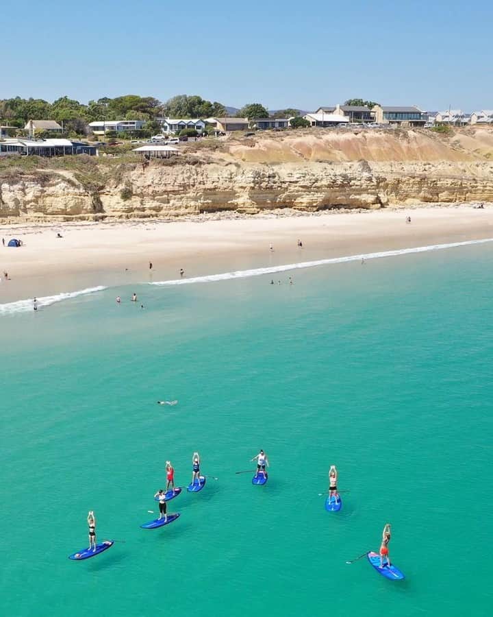 Australiaさんのインスタグラム写真 - (AustraliaInstagram)「@southaustralia really turned it on for the stand-up paddle boarders out and about on this lovely day! ☀️ @supdownsouth captured this aerial shot of one of their tours in full swing at #PortWillunga, which is a beautiful #beach located 45 minutes from #Adelaide. This picturesque part of the @officialfleurieupeninsula has a soft sandy beach that is overlooked by cliffs which fishermen once carved caves into for boat and net storage, which now form perfect shady spots on sunny days. TIP: Don’t leave without sampling the ultra-fresh seafood at @StarOfGreece, complete with an epic view overlooking the beach, it’s a must-do when you’re in town.  #seeaustralia #southaustralia #fleurieupeninsula #travel #landscapephotography」5月8日 20時00分 - australia