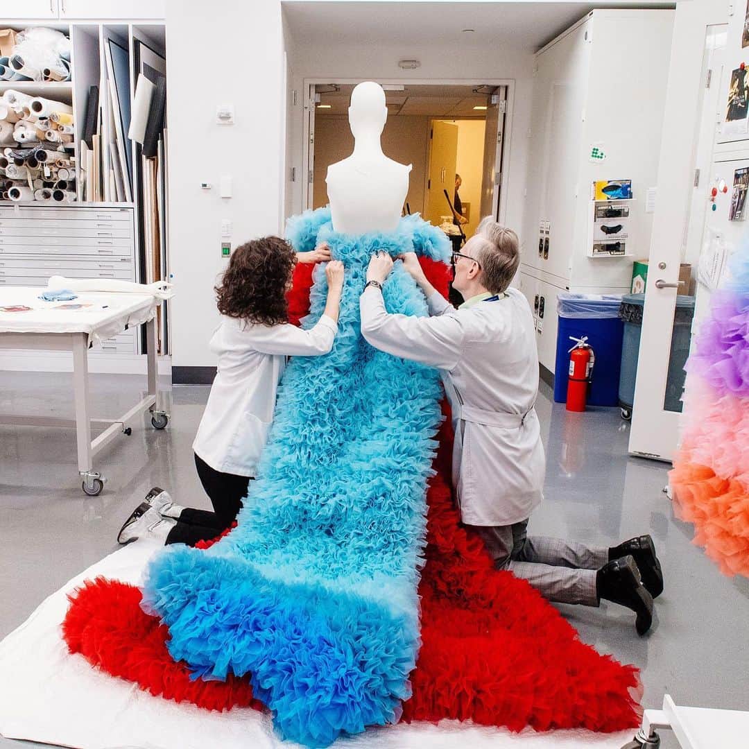 Vogue Runwayさんのインスタグラム写真 - (Vogue RunwayInstagram)「Tulle bombs, tiny gloves, precise, meticulous movement: This is the kind of attention that is required inside the conservator space at the @MetCostumeInstitute, a place where, just days before the #MetGala celebrating "Camp: Notes on Fashion," the museum's team of conservators were hard at work unpacking and cataloging some 170 pieces of precious fashion. A troublesome but spectacular-looking glove was just one small element of the two fantastically bulbous tulle confections made by the Japanese designer @TomoKoizumi for the “Camp” show, Koizumi's first time being displayed in a museum exhibition. This honor comes just a few short months after he sped to international fame. Tap the link in our bio for more details. Photographed by @hunterabrams」5月9日 3時24分 - voguerunway