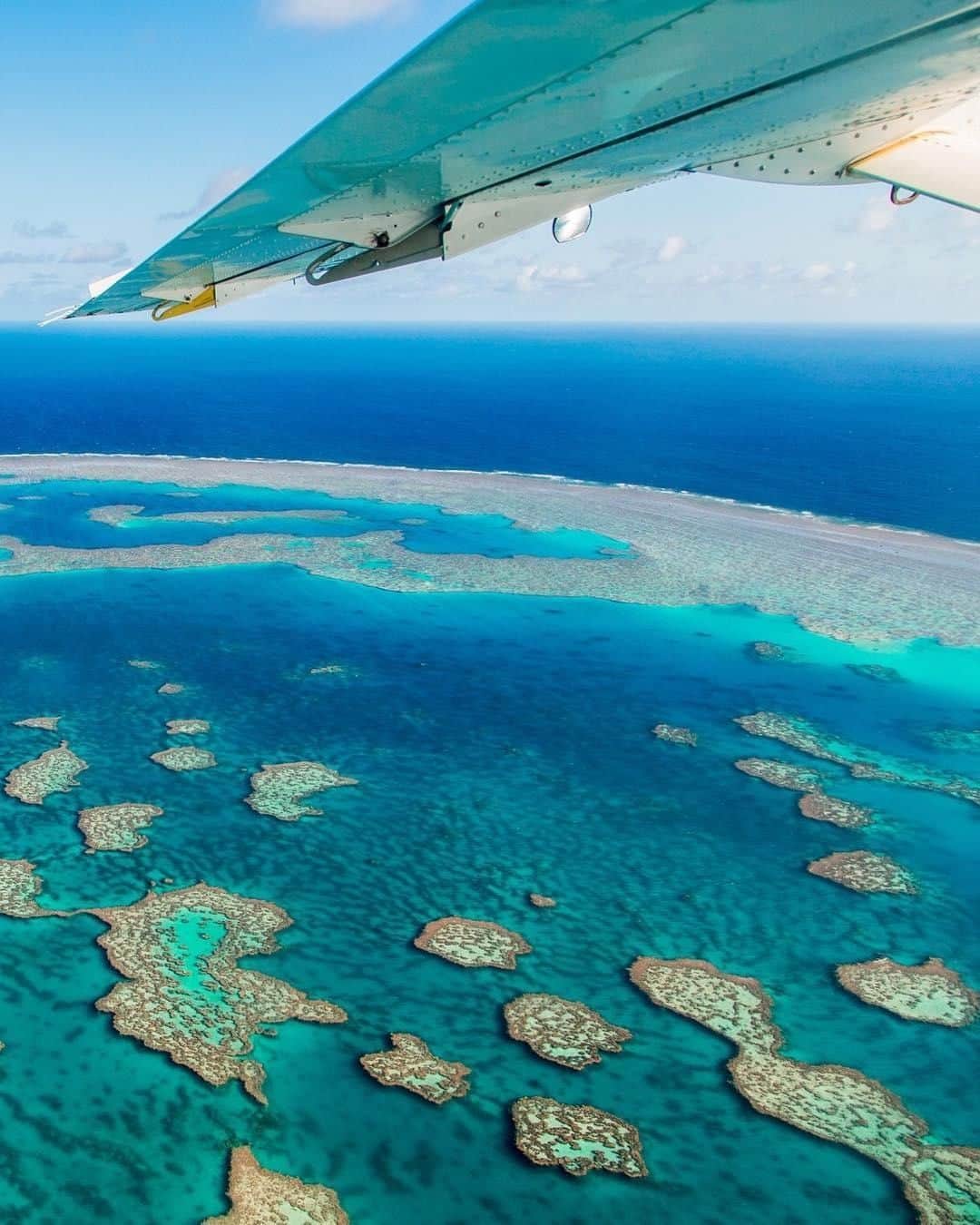Australiaさんのインスタグラム写真 - (AustraliaInstagram)「The window seat is a must when flying over the #GreatBarrierReef! 🛩️ @williamhoki enjoyed this breathtaking view on a scenic flight over the @gbrmarinepark with @air_whitsunday recently, which really is a bucket list @queensland experience. The reef stretches for 2,300 kilometres, so seeing it from the air is the best way to put its size and scale into perspective. After the flight, go snorkelling or diving to get up close and personal with the abundance of marine life that call this natural wonder home; @sailingwhitsundays, @zigzagwhitsundays and @tusadive all run guided tours that will take you to the best spots.  #seeaustralia #thisisqueensland #lovethereef #naturephotography #travel」5月9日 4時00分 - australia