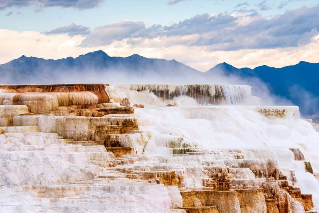 National Geographic Travelさんのインスタグラム写真 - (National Geographic TravelInstagram)「Photo by @KristaRossow | Steam rises from Canary Springs at Yellowstone National Park. The beautiful shapes of the travertine terraces at Mammoth Hot Springs are constantly changing as calcium carbonate (dissolved limestone) is deposited on the surface by thermal waters. Yellowstone, the United States' first National Park, is home to over 10,000 hydrothermal features. Follow me @KristaRossow for more images from around the world. #Yellowstone #Wyoming #hotspring」5月11日 13時08分 - natgeotravel