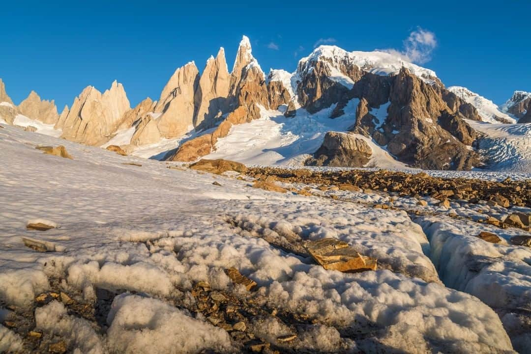 National Geographic Travelさんのインスタグラム写真 - (National Geographic TravelInstagram)「Photo by @michaelclarkphoto | The western (backside) of Cerro Torre rising above the Patagonia Ice Cap at sunset near El Chalten, Argentina. This image is from a few years ago but I often find myself daydreaming about this location and this trip. For me, this is the throne room of the mountain gods as the late Galen Rowell used to say. There are few places on Earth as gorgeous as this (at least for a mountaineer). This is the hard side of Cerro Torre to get to and involves huge packs, some relatively steep climbing up a 3,000-foot (900 m) waterfall and lots of glacier travel. I can't wait to get back there -- and I pray the weather is as nice the next time as it was on this journey. #cerrotorre #patagonia #patagoniaicecap #chile #argentina」5月11日 19時20分 - natgeotravel