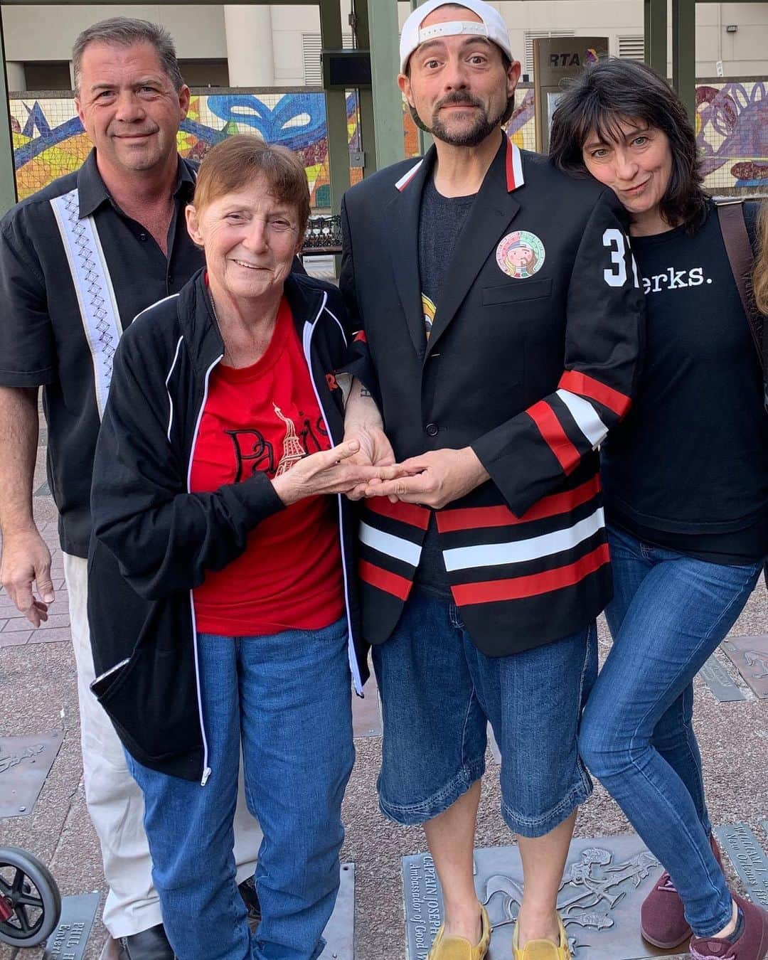 ケヴィン・スミスのインスタグラム：「Happy Mother’s Day to my 2 favorite Maternal forces in the universe: my Mom who made me, and my wife Jen - the Mom who made me a Dad! @donsgirlgrace raised three kids on a lower, lower, LOWER middle-class budget, two of whom turned out amazing (the jury’s still out on the youngest). When I met @jenschwalbach, she wasn’t anybody’s Mom and I wasn’t looking for a mate who was Mother material: I was just looking to get laid. Turns out, if you’re not careful, those separate agendas can go hand-in-hand. So by way of simple 28 year old lust, I found the only other Mother who’d mean as much to me as my Mom. And it occurs to me that that’s how my Dad found my Mom too. At the root of every beloved Mother is a primal lust that overlooks all the inherent shortcomings of her mate. And at the root of every dopey Dad... is a real Motherfucker. #KevinSmith #mothersday #mom #jenniferschwalbach #gracevsmith」