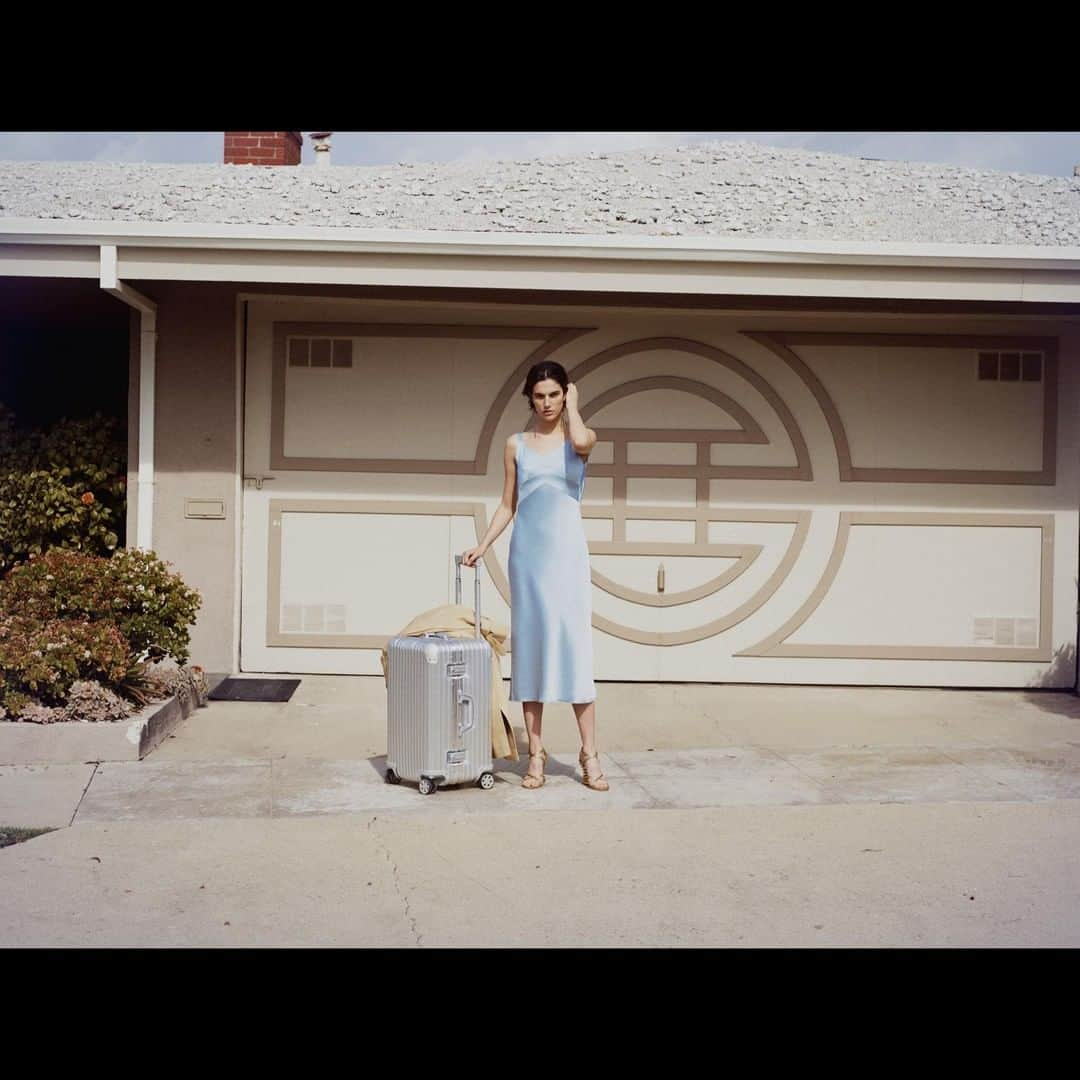 RIMOWA - Alina and her RIMOWA Essential Cabin in red. Captured by James  Brodribb.