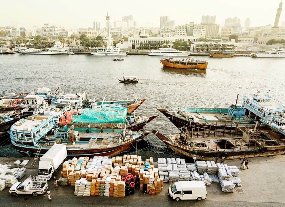 National Geographic Travelさんのインスタグラム写真 - (National Geographic TravelInstagram)「Photo by @lucalocatelliphoto | Echoes of Old Dubai linger around the Creek, the harbor where the city was born. The atmospheric area houses the offices of the Emirate’s ruling Sheikh and dozens of foreign consulates. Dhows still ply its waters for tourism and trade. My work revolves around the making of the future, how our society transitions through new ways of living, and how technology is changing our approach to the environment and to our cities. I’ve embarked on a journey with @natgeo to showcase how Dubai aims to become one of the world’s greenest cities. Follow me @lucalocatelliphoto to find out more about the Dubai story I covered for @natgeo #Dubai #environment #creek #harbour #sunset #city」5月15日 7時09分 - natgeotravel