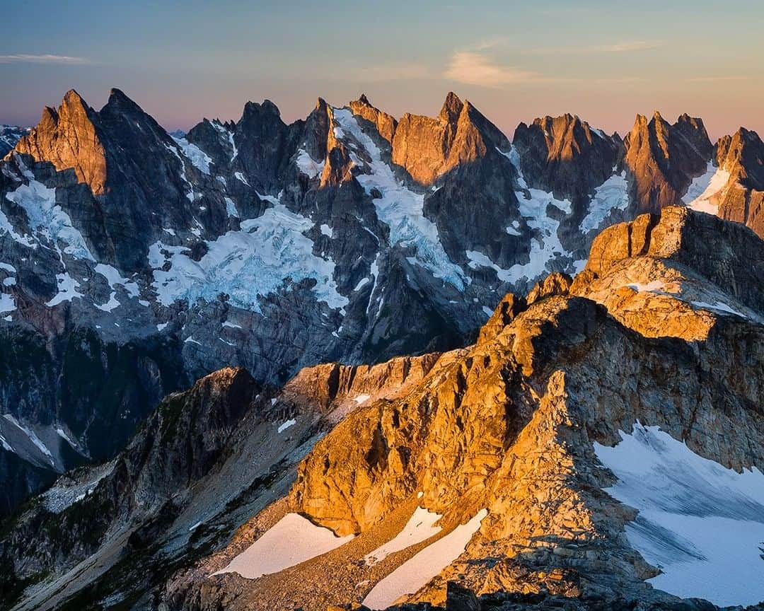 National Geographic Travelさんのインスタグラム写真 - (National Geographic TravelInstagram)「Photo @stephen_matera | Sunrise on the Southern Picket Range in late summer, deep in the North Cascades of Washington state. The Pickets are a remote and extremely rugged subrange of the North Cascades with 21 peaks over 7,500' and multiple glaciers. Peak names are appropriately named for the awe and fear they inspire in climbers. Names like Mt. Fury, Terror, Challenger, and Phantom. Follow me @stephen_matera for more images like this from Washington and around the world. #wilderness #picketrange #northcascades」5月16日 10時07分 - natgeotravel