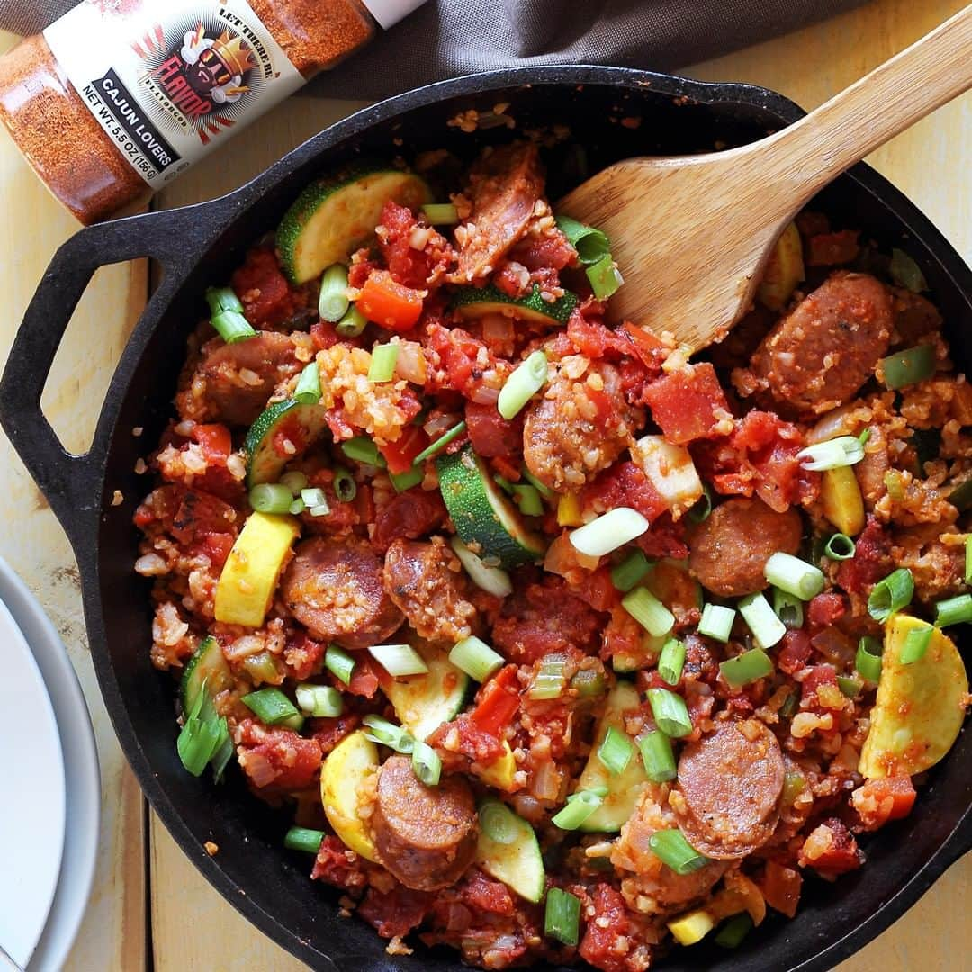 Flavorgod Seasoningsさんのインスタグラム写真 - (Flavorgod SeasoningsInstagram)「ANDOUILLE SAUSAGE & VEGGIES SKILLET⠀ ⠀ Simple and hearty skillet meal with a whole lot of healthy flavors. ⠀ Features Flavor God CAJUN LOVERS Seasoning.⠀ #⠀ From @paleo_newbie_recipes:⠀ #⠀ INGREDIENTS:⠀ 2 tablespoons of olive oil⠀ 8 ounces of andouille sausage, sliced⠀ 1 medium onion, diced⠀ 1/2 large green bell pepper, diced⠀ 1/2 large red bell pepper, diced⠀ 1 stalk celery, chopped⠀ 3 cloves garlic, chopped⠀ 1 tablespoon Flavor God CAJUN LOVERS Seasoning⠀ 4 cups pre-cooked cauliflower rice (we used Trader Joe's) or parboiled ⠀ white rice⠀ 1 can (14.5 ounces) fire-roasted diced tomatoes⠀ Fresh scallions⠀ 1 cup zucchini, sliced⠀ 1 cup yellow squash, sliced⠀ Salt & pepper, to taste⠀ #⠀ INSTRUCTIONS:⠀ --⠀ Heat a large skillet with the olive oil on medium. Add in the andouille ⠀ sausage, onion, bell peppers, and garlic.⠀ Cook 10 minutes, stirring frequently.⠀ --⠀ Next stir in the pre-cooked rice, zucchini, squash, tomatoes and season ⠀ with 1 tablespoon or more of Flavor God CAJUN LOVERS Seasoning – adjust ⠀ to taste. Season with a dash or two of salt and pepper. Cook another 2-3 ⠀ minutes, or just until rice is heated through.⠀ --⠀ Serve hot garnished with chopped scallions and enjoy!」5月17日 10時00分 - flavorgod