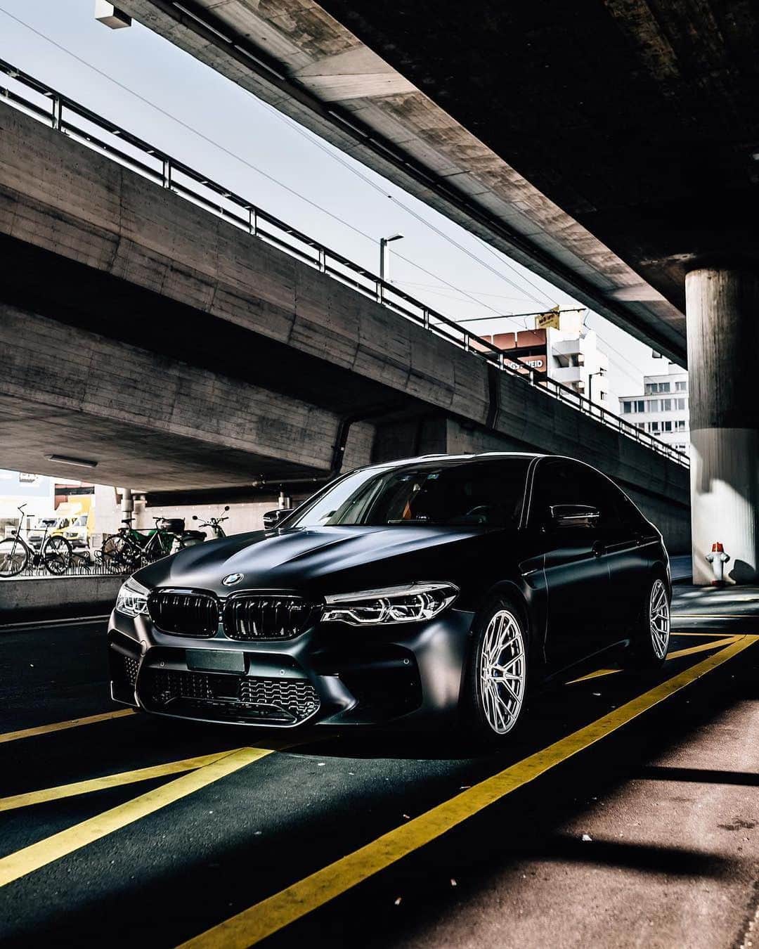 BMWのインスタグラム：「You can't miss this view.  The BMW M5 Sedan.  #BMWrepost @georgiancollector @vardzhiyski #BMW #M5 #BMWM __ BMW M5 Sedan: Fuel consumption in l/100 km (combined): 10.8 - 10.7. CO2 emissions in g/km (combined): 246 - 243. The values of fuel consumptions, CO2 emissions and energy consumptions shown were determined according to the European Regulation (EC) 715/2007 in the version applicable at the time of type approval. The figures refer to a vehicle with basic configuration in Germany and the range shown considers optional equipment and the different size of wheels and tires available on the selected model. The values of the vehicles are already based on the new WLTP regulation and are translated back into NEDC-equivalent values in order to ensure the comparison between the vehicles. [With respect to these vehicles, for vehicle related taxes or other duties based (at least inter alia) on CO2-emissions the CO2 values may differ to the values stated here.] The CO2 efficiency specifications are determined according to Directive 1999/94/EC and the European Regulation in its current version applicable. The values shown are based on the fuel consumption, CO2 values and energy consumptions according to the NEDC cycle for the classification. For further information about the official fuel consumption and the specific CO2 emission of new passenger cars can be taken out of the „handbook of fuel consumption, the CO2 emission and power consumption of new passenger cars“, which is available at all selling points and at https://www.dat.de/angebote/verlagsprodukte/leitfaden-kraftstoffverbrauch.html.」