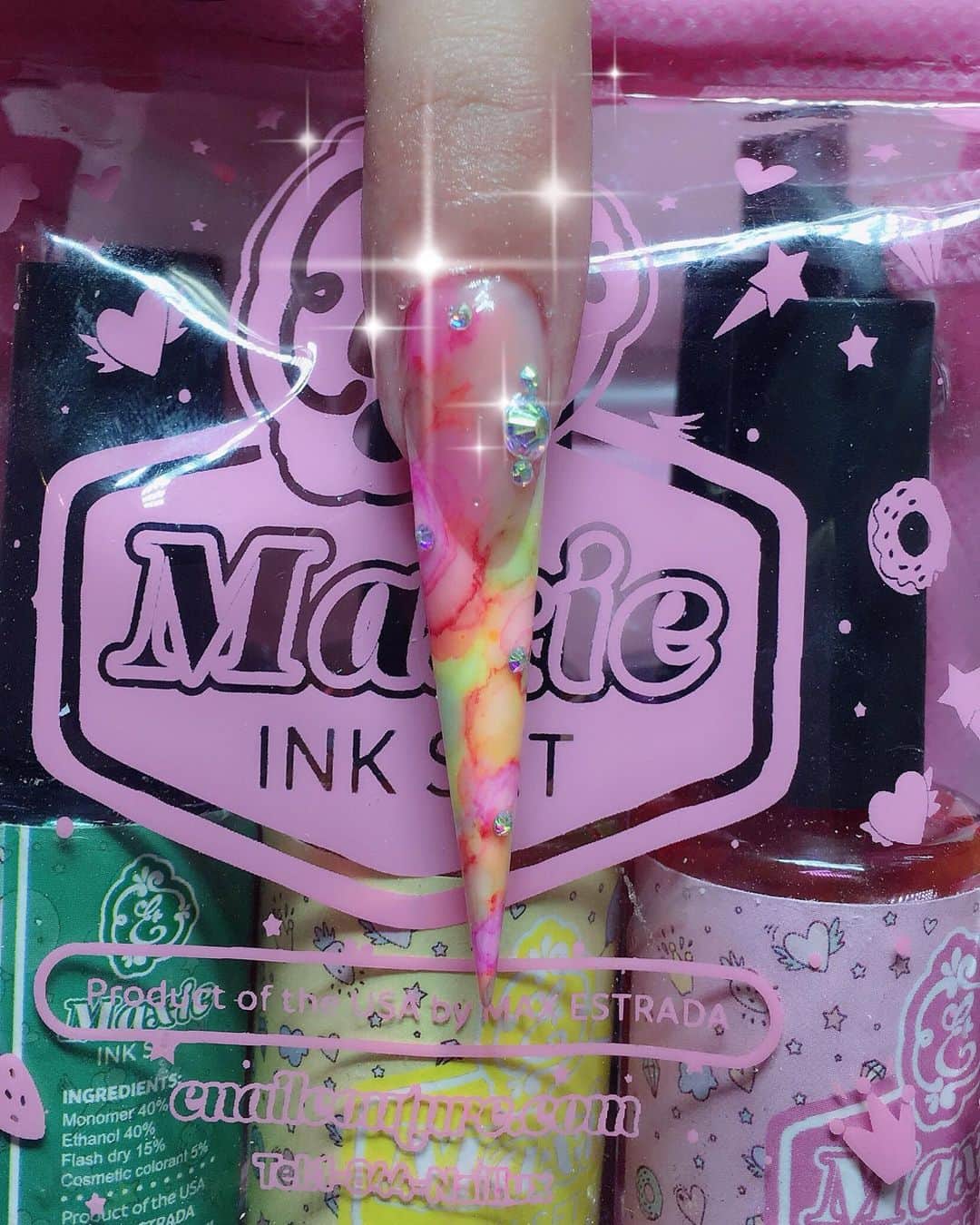 Max Estradaさんのインスタグラム写真 - (Max EstradaInstagram)「Enailcouture.com MAXIE INK SET volume 2 IS HERE !  MAGICALY MAKE BEAUTIFUL WATERCOLOR, TIE-DYE & MARBLING EFFECTS AND MORE WITH EASE! OUR AMERICAN MADE COSMETIC QUALITY APPROVED NAIL INKS! . MAXIE INK SET WORKS ONLY WITH VELVET MATTE GEL AS A SURFACE . PLEASE APPLY A LAYER OF VELVET MATTE TOPCOAT OVER COLOR GEL BEFORE APPLYING MAXIE INK. SEAL WITH A COAT OF SHINEE OR WONDER-GEL FOR A BEAUTIFUL, DIAMOND LIKE FINISH! MAXIE INK SET CONTAINS 6 COLORS AND COMES IN A CUTE CARRY POUCH !  COLORS ARE Beige, white, sky blue, crimson red, lavender, pastel gree  https://Enailcouture.com acrylic system in crystal clear powder with disco pure glitter mix and cotton candy monomer and diamond holic 23, gummy gel and wonder gel top coat ! New nail art diamonds are here ! Diamond carousel in 3 types to choose from ! Only $3.99 in the USA ! Apply with shinee and gummy gel for a dazzling finish! Here we used eternal beige powder and cotton candy monomer #ネイル #nailpolish #nailswag#nailaddict#nailfashion #nailartheaven#nails2inspire#nailsofinstagram #instanails#naillife#nailporn #gelnails #gelpolish#stilettonails#nailaddict #nailcolor#nailsalon #nailproducts #nailsupplies#acrylicnails #nailsdid #nailsoftheday https://Enailcouture.com happy gel is like acrylic and gel had a baby ! Perfect no mess application, candy smell and no airborne dust ! https://Enailcouture.com」5月18日 1時05分 - kingofnail