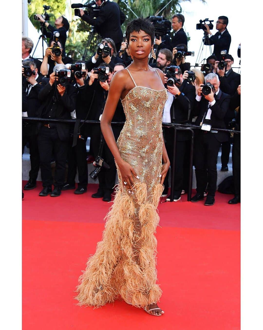 のインスタグラム：「@iammariaborges wears an evening dress allover embroidered with gold micro fireworks details and blush ostrich feather flowers from the #RobertoCavalliCouture collection, while attending the movie premiere of "The Rocketman", during the 72nd Cannes Film Festival. #cannes #Cannes2019」
