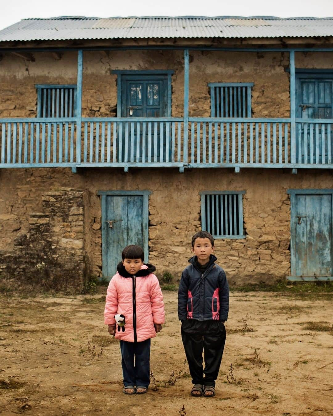 ナショナルジオグラフィックさんのインスタグラム写真 - (ナショナルジオグラフィックInstagram)「Photo by Adam Ferguson @adamfergusonstudio | In the Himalayan foothills, Sherpa children stand outside Bodha Primary School in Bohane Village, Nepal. Bohane and the local school were damaged by an aftershock of the April 25, 2015, earthquake, which killed nearly 9,000 people and injured nearly 22,000. Four years later families continue to rebuild their lives. Follow me at @adamfergusonstudio to see more stories about critical social issues. #adamferguson #natgeo #environment #nepal」5月18日 15時35分 - natgeo