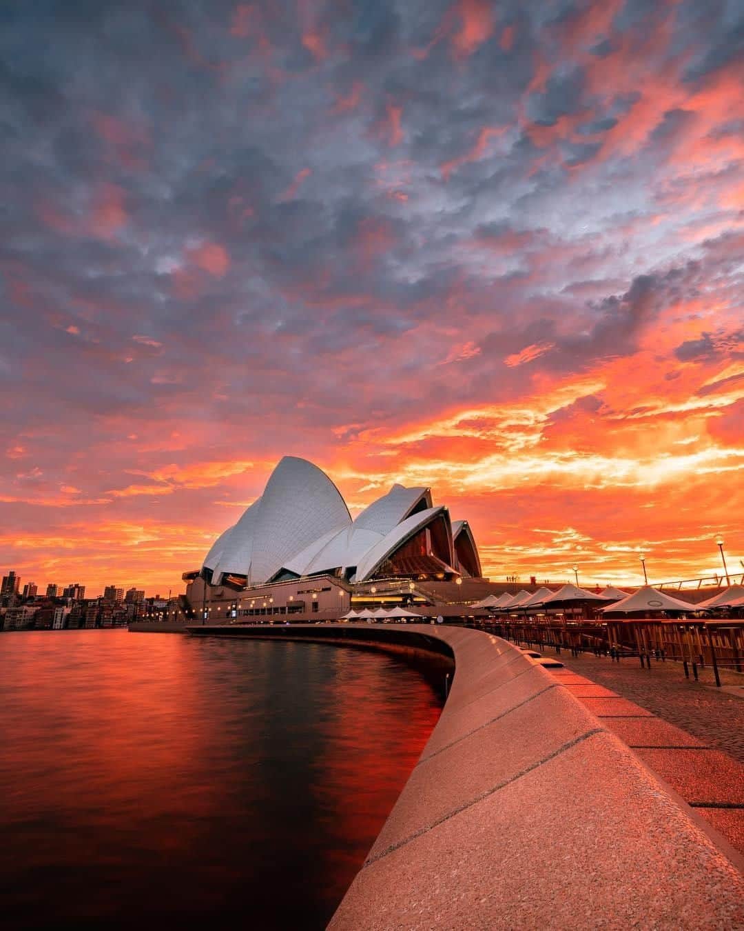 Australiaさんのインスタグラム写真 - (AustraliaInstagram)「A simply surreal @Sydney sunrise. 🔥 Autumn has been delivering some absolutely stunning #sunrise and sunset action, and this super colourful morning captured by @fumiyasutomi at #CircularQuay was no exception. Speaking of colours, #Sydney will soon be lighting up every evening in a different way, with the annual @vividsydney festival kicking off later this month on 24 May. For 23 days, the city will be transformed into an enormous outdoor art gallery, with light art sculptures, installations and grand-scale projections lighting up the night. Definitely a sight worth seeing!  #seeaustralia #ilovesydney #NewSouthWales #vividsydney #sydneyoperahouse #travel」5月19日 4時00分 - australia