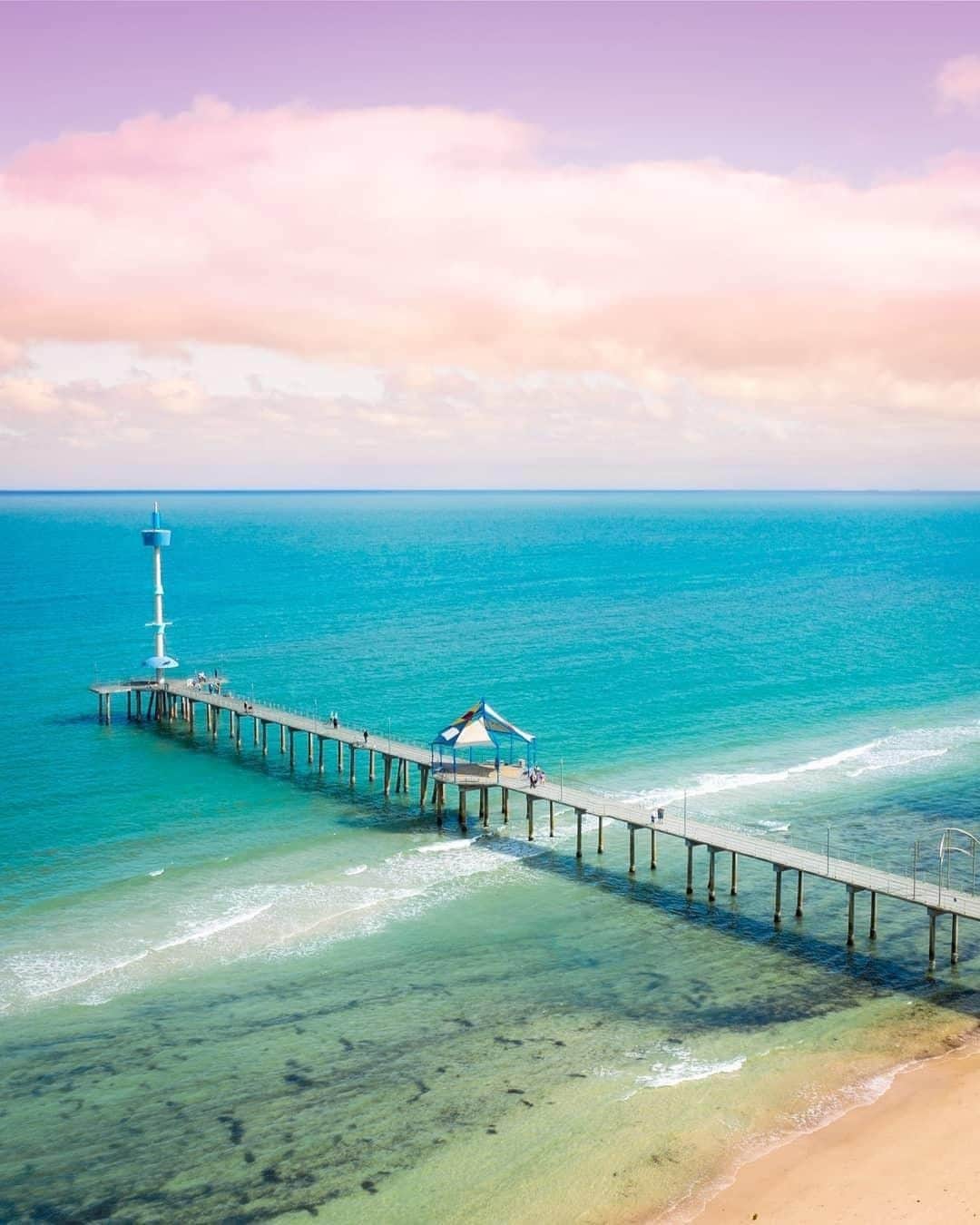Australiaさんのインスタグラム写真 - (AustraliaInstagram)「We’re loving this fairy floss sky, @southaustralia! 😍 @m.hemb snapped this colourful shot at #BrightonJetty, an iconic site at  #BrightonBeach which is just half an hour from the #Adelaide CBD. Cool cafes and restaurants line the road leading up the jetty, so we highly recommend starting with a bite to eat at @viewat85, @cafelunebrighton or @beachpitbrighton, then getting an ice cream for your stroll to the jetty, enjoying it as you admire the views (if you haven’t already finished it on the way there, that is.) 😉  #seeaustralia #seesouthaustralia #travel #explore #travelgram #photooftheday」5月19日 20時00分 - australia