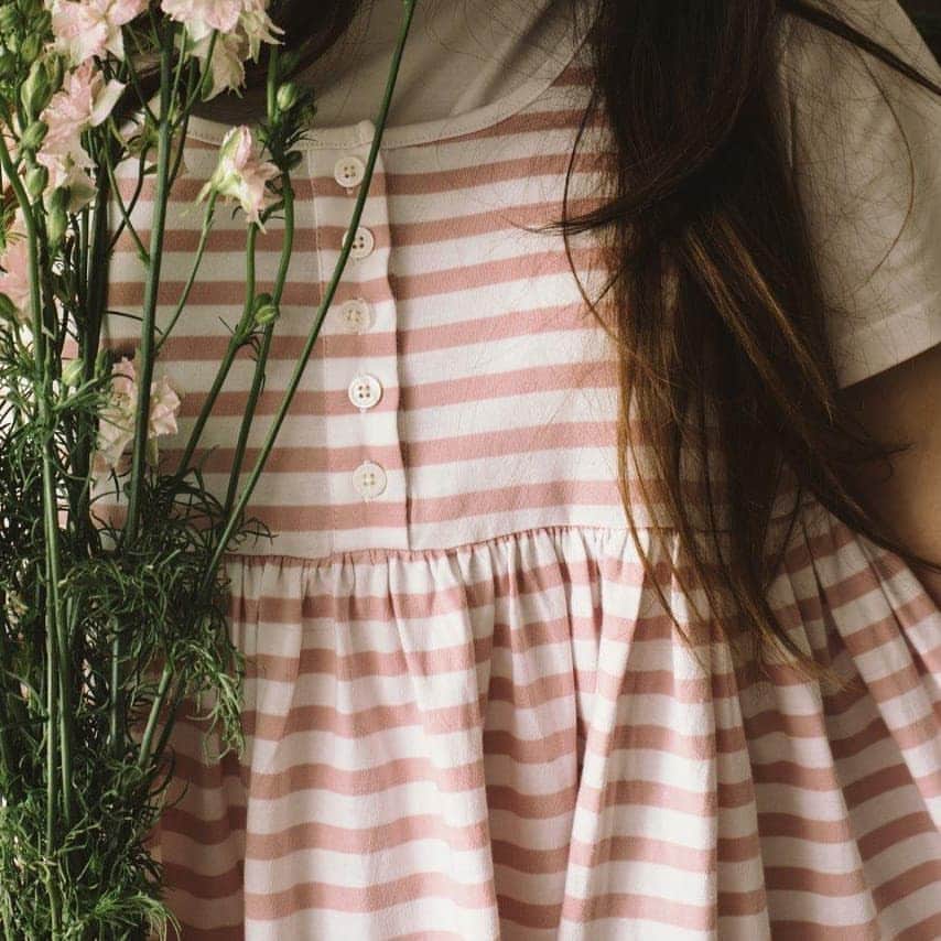 キャベジズ&ローゼズのインスタグラム：「Thinking pink. Cabbages & Rose's pink & white edit now online. Here the beautiful @just_belle in organic pink stripe shabby dress.  #organiccotton #organicfashion #consciousliving #pink #white #cabbagesandroses #cabbagesandroseslifestyle #cabbagesandrosesfashion #livinglifebeautifully #summerdress @christina_strutt @just_belle @cabbagesandroses_shop」