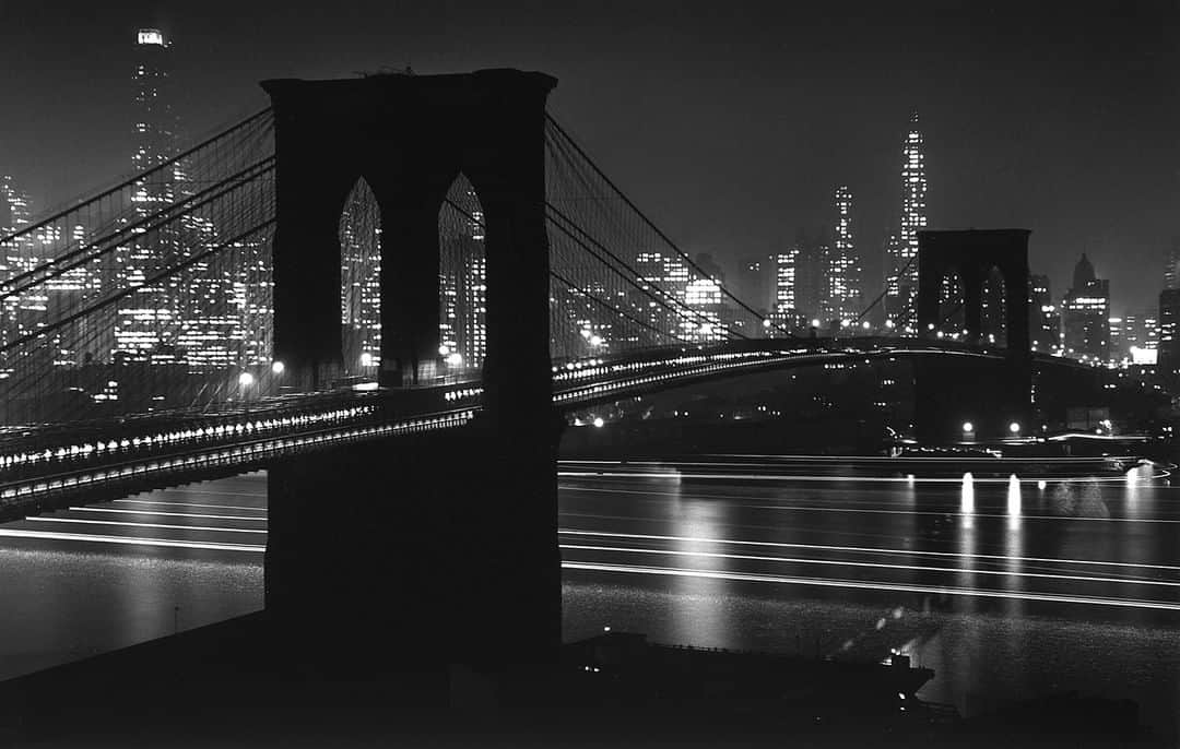 lifeさんのインスタグラム写真 - (lifeInstagram)「65 years ago this week from the May 24, 1954 feature: "BROOKLYN BRIDGE—71 YEARS YOUNG: The Roeblings' engineering masterpiece, a marvel of its age, is now even better than new after four years of refurbishing." This image opened the story with the following caption: "Brooklyn Bridge is an aerial flight over New York's East River held by steel gossamers slung between tremendous stone Gothic towers. Here the 1,595-foot-long span is seen at dusk from the Brooklyn side against the brilliantly lighted towers of downtown Manhattan." (Andreas Feininger—The LIFE Picture Collection/Getty Images) #thisweekinLIFE #BrooklynBridge」5月20日 22時04分 - life