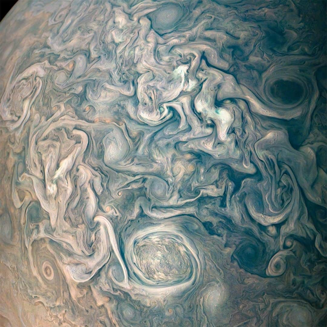 NASAさんのインスタグラム写真 - (NASAInstagram)「Witness the chaotic clouds of Jupiter dancing to a turbulent tune. ☁️☁️☁️ ⁣ ⁣ Our @NASAJuno spacecraft took this color-enhanced image as the spacecraft performed its 13th close flyby of Jupiter in May 2018.The darker cloud material is deeper in Jupiter’s atmosphere, while bright cloud material is high. The composition of these bright clouds are most likely ammonia or ammonia and water, mixed with a sprinkling of unknown chemical ingredients. ⁣ ⁣ Enhanced Image by Gerald Eichstadt and Sean Doran (CC BY-NC-SA) based on images provided Courtesy of NASA/JPL-Caltech/SwRI/MSSS ⁣ #NASA #Jupiter #SolarSystem #Storms」5月21日 2時09分 - nasa