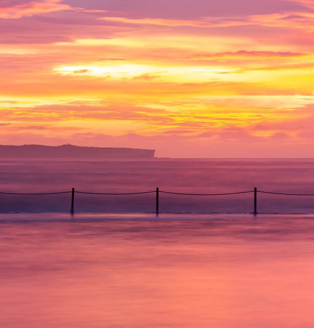 Nikon Australiaさんのインスタグラム写真 - (Nikon AustraliaInstagram)「"Autumn is always a great time for spectacular sunrises on the East coast. On this morning I thought I'd missed the best of it, but as soon as I reached the beach the sky exploded into the most amazing pinks, reds and yellows, leaving me scrambling to set up and find a composition. Using a 6 stop ND filter allowed me to lose the early morning swimmers from the exposure, keeping the image simple." - @pearce_m  Camera: Nikon #D7100 Lens: AF-S DX NIKKOR 18-200mm f/3.5-5.6G ED VR II Settings: F/8 | 20s | ISO 100  #MyNikonLife #Nikon #NikonAustralia #NikonTop #Photography #DSLR #LandscapePhotography #OceanPhotography #WaterPhotography #SunrisePhotography」5月21日 13時32分 - nikonaustralia