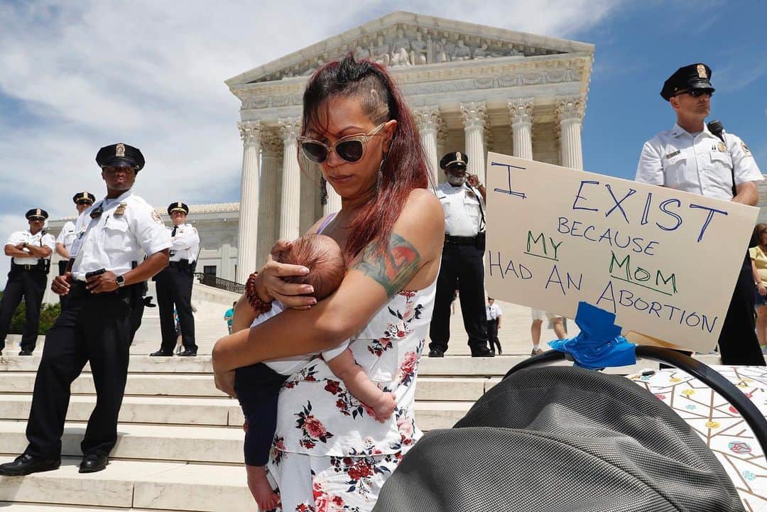 NBC Newsさんのインスタグラム写真 - (NBC NewsInstagram)「As security guards the steps of the Supreme Court, Kristin Mink of Silver Spring, Md., holds her three-week-old daughter by a sign she brought that says, "I exist because my Mom had an abortion," as Mink joined a protest against abortion bans outside the Supreme Court in Washington. 📷 @jacquelynmartin / @apnews . Bliss Vandeventer and Vivian Malan dressed as "hand maidens," hold signs at a rally to oppose recent abortion bans at the State Capitol Building in Salt Lake City, Utah. 📷 @applefritterparty / @AFPphoto . People protest against Georgia's recently passed "heartbeat" bill at the Georgia State Capitol building in Atlanta. 📷 @wanderinghome / @gettyimages . Women's rights advocates demonstrate against recent abortion bans in Philadelphia. 📷 @apmrourke / @apnews . Gracie Burke, 19, center, a student at American University, joins other in a protest against abortion bans outside the Supreme Court in Washington. 📷 @jacquelynmartin / @apnews . Julia Sands, center, cheers with others during a rally in support of abortion rights in Las Vegas. 📷 @locherphoto / @apnews」5月22日 6時50分 - nbcnews