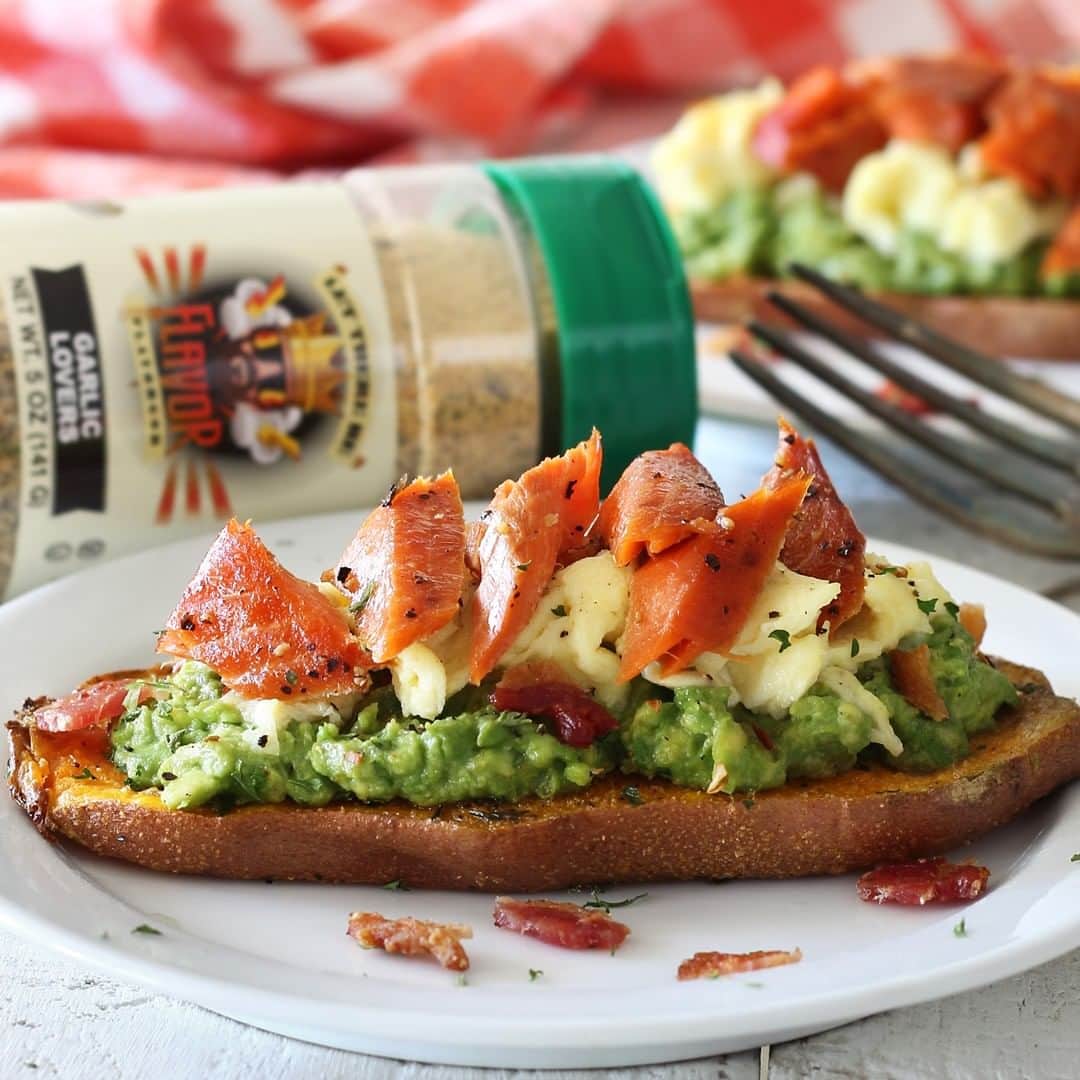 Flavorgod Seasoningsさんのインスタグラム写真 - (Flavorgod SeasoningsInstagram)「SWEET POTATO "TOAST" with ROASTED SALMON⠀ ⠀ Something a little different to try for breakfast – a sweet potato "toast" topped with guac, eggs, and roasted salmon. Recipe features salmon from @sizzlefishfit and Flavor God GARLIC LOVERS Seasoning.⠀ #⠀ •From @paleo_newbie_recipes:⠀ #⠀ INGREDIENTS⠀ #⠀ 1 sweet potato, cut lengthwise into 1/4" thick slices⠀ 1 avocado⠀ 2 slices cooked bacon⠀ 4 eggs⠀ Salmon filet, roasted or smoked⠀ Olive oil⠀ 1/2 lemon⠀ Flavor God GARLIC LOVERS Seasoning⠀ Salt & pepper⠀ #⠀ INSTRUCTIONS⠀ #⠀ Preheat oven to 425ºF⠀ --⠀ Cut sweet potato lengthwise into 1/4" thick slices. Drizzle olive oil over to coat, then season slices generously with Flavor God GARLIC LOVERS Seasoning, plus salt & pepper to taste.⠀ --⠀ Place sweet potato slices on a greased baking sheet and cook about 15-20 minutes in 425ºF oven, or until potato slices are tender.⠀ --⠀ Meanwhile, in a small bowl, mash avocado flesh with a fork. Add a little Flavor God GARLIC LOVERS Seasoning and a squeeze of lemon.⠀ --⠀ Scramble eggs and fry bacon.⠀ --⠀ Remove sweet potato toast from oven and top with guacamole, scrambled eggs, crumbled roasted salmon and a sprinkle of chopped bacon.⠀ ⠀ -⠀ -⠀ #food #foodie #flavorgod #seasonings #glutenfree #mealprep  #keto #paleo #vegan #kosher #breakfast #lunch #dinner #yummy #delicious #foodporn」6月21日 21時00分 - flavorgod