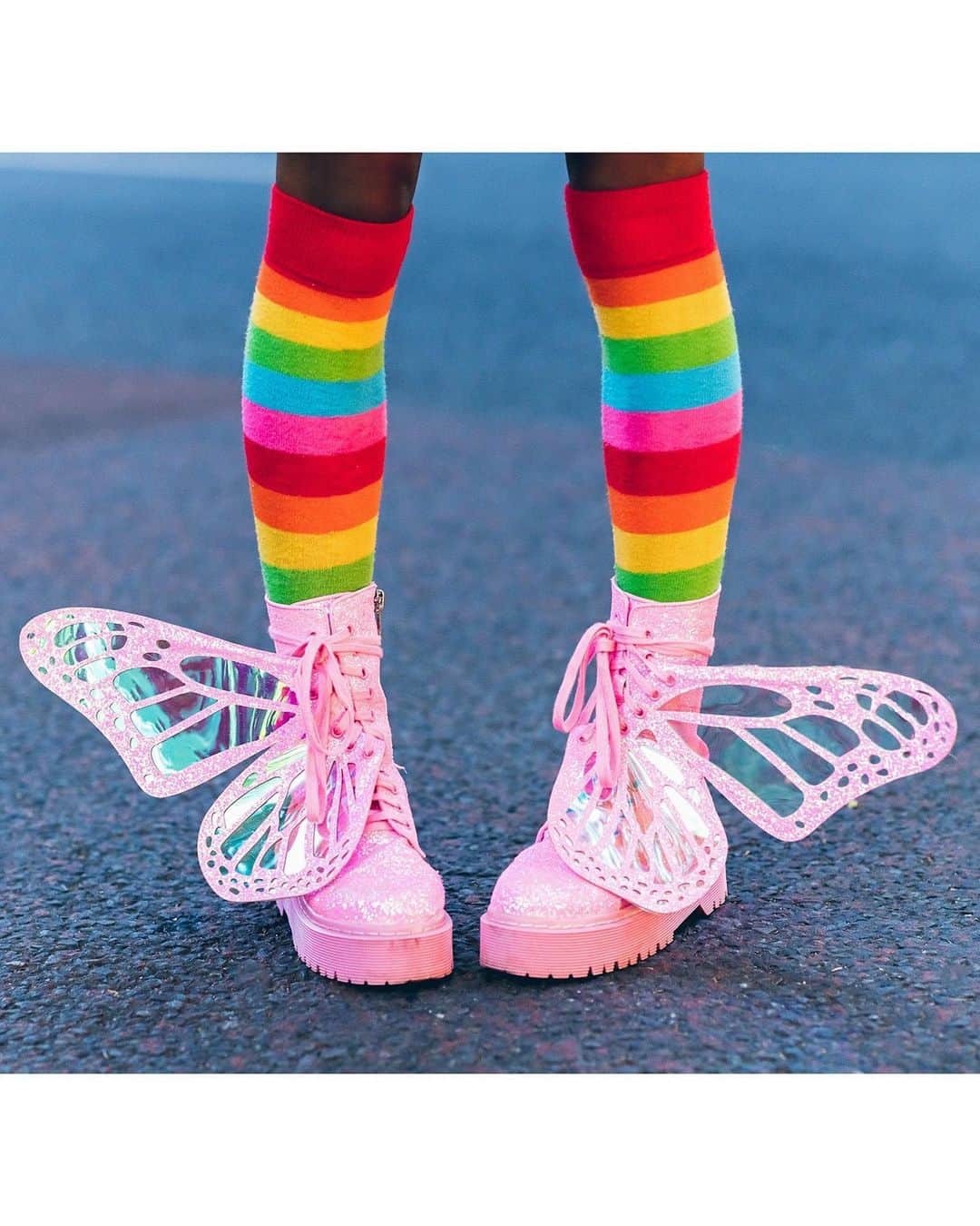 Harajuku Japanさんのインスタグラム写真 - (Harajuku JapanInstagram)「Sierra (@frokyo) on the street in Harajuku wearing a rainbow top and matching rainbow socks, a suspender skirt, heart choker with plushie, and platform glitter butterfly wing boots. She didn't share her brand info, but she said that @DollsKill is her favorite place to shop for fashion!」6月21日 23時43分 - tokyofashion