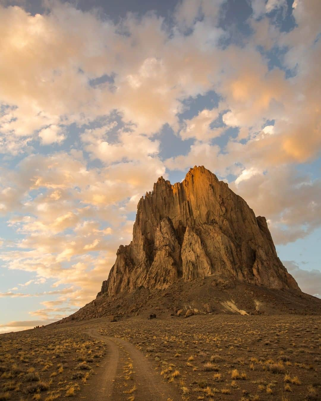 National Geographic Travelさんのインスタグラム写真 - (National Geographic TravelInstagram)「Photo by Aaron Huey @argonautphoto | From a road trip searching for American Cathedrals. In this image from the Navajo Nation: Sunset on Ship Rock or Tsé Bitʼaʼí ("rock with wings"), in northern New Mexico. The name comes from the legend of the great bird that brought the Navajo from the north to their current homelands. For more images of American cathedrals, follow me @argonautphoto. #AmericanCathedrals #NavajoNation」6月22日 1時11分 - natgeotravel