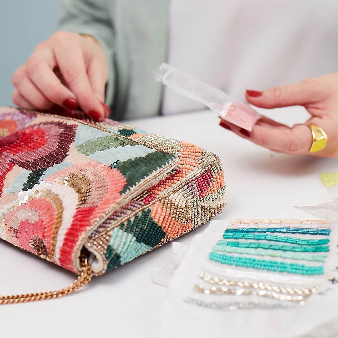 アクセサライズのインスタグラム：「Embellished by hand, our Jasmine clutch bag features glamorous floral decoration in the form of glistening beads and sequins in red, pink, aqua blue and gold. Your stunning date for summer event season.  Tap the link in the bio to discover more on the blog now.  #Accessorize #DesignStories」