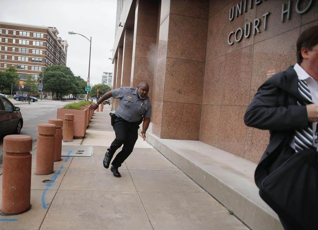 TIME Magazineさんのインスタグラム写真 - (TIME MagazineInstagram)「A heavily armed, masked gunman opened fire at a federal courthouse in downtown #Dallas on June 17. The shooter, identified as a 22-year-old, was fatally shot in an “exchange of gunfire” with federal officers, according to the city's police department. Veteran @dallasnews photographer Tom Fox, who was at the scene for a routine assignment, captured intense images as the shooting unfolded. “I squeezed off a few frames as he picked something up—a clip, I think—and then I turned and ran,” he recalled in an account to his newspaper. Fox hid behind a column and “just kept thinking, 'He's going to look at me around that corner and he's going to shoot.” In these photographs: a security guard and a civilian run for cover as bullets ricochet off the building as a shooter (far background, left) fires towards them; federal employees take cover behind a car in a parking lot; security officers, left, and a member of the U.S. Marshals Service, right, head towards the downed gunman; and the shooter is tended to in a parking lot. No officers or citizens were reported injured. Read more at the link in bio. Photographs by Tom Fox (@weatherfox)—@dallasnews/@apnews」6月18日 21時38分 - time