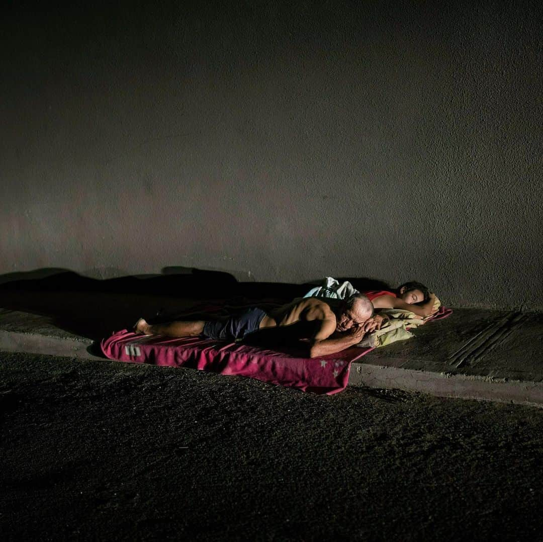 TIME Magazineさんのインスタグラム写真 - (TIME MagazineInstagram)「#Venezuela’s unprecedented energy crisis has left residents of its second largest city, #Maracaibo, without power for long periods in the past three months. In these photographs in May, people sleep on the sidewalk to escape the sweltering heat there and a dog is illuminated by a car during a blackout. Photographs by @abdrodrigo—@apnews」6月19日 11時14分 - time