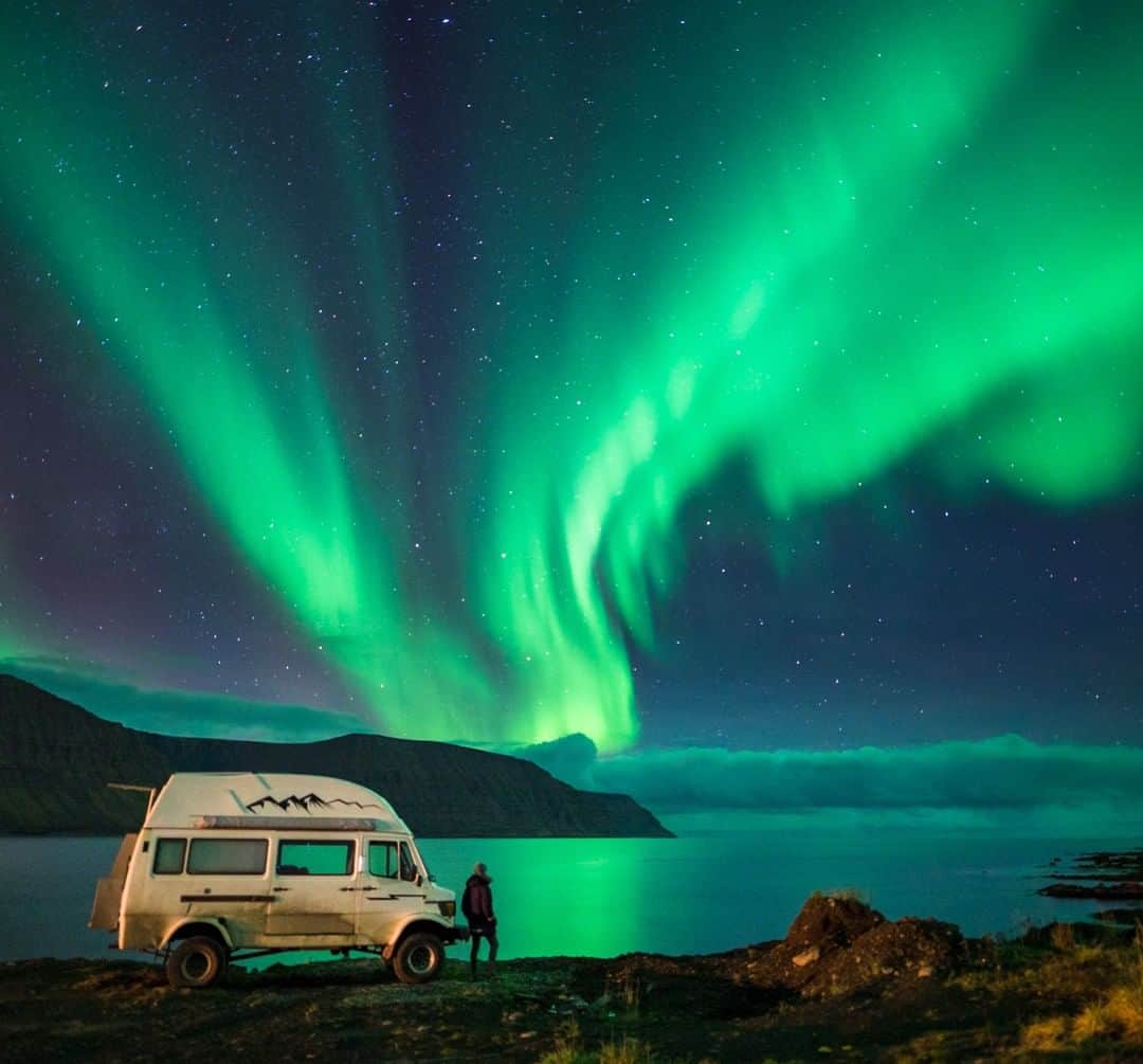 National Geographic Travelさんのインスタグラム写真 - (National Geographic TravelInstagram)「Photo by @Chrisburkard | It’s these lights that keep me coming back– I’ve been to Iceland over 30 times (and have many more trips there planned) and this spectacle is one of the reasons I’m so drawn to the small island country. There’s something special about its people and much of the landscapes themselves are breathtaking as well, but standing below this natural phenomenon is inexplicable. The scientific term for this display is an aurora, specifically an Aurora Borealis for the northern hemisphere, which is pictured above. On the simplest level, these bright lights are actually collisions between electrically charged particles emitted from the sun and gaseous particles in the Earth’s atmosphere. I always seek situations where the outdoors makes me feel small, and knowing this event stems from particles shot all the way from the sun makes me feel just about as small as I can imagine. It was extra humbling to take in this view with Heiðar Logi, an Icelandic local who has spent much time under these colors, but is still just as awe-struck as I am every time he sees them.」6月19日 7時00分 - natgeotravel