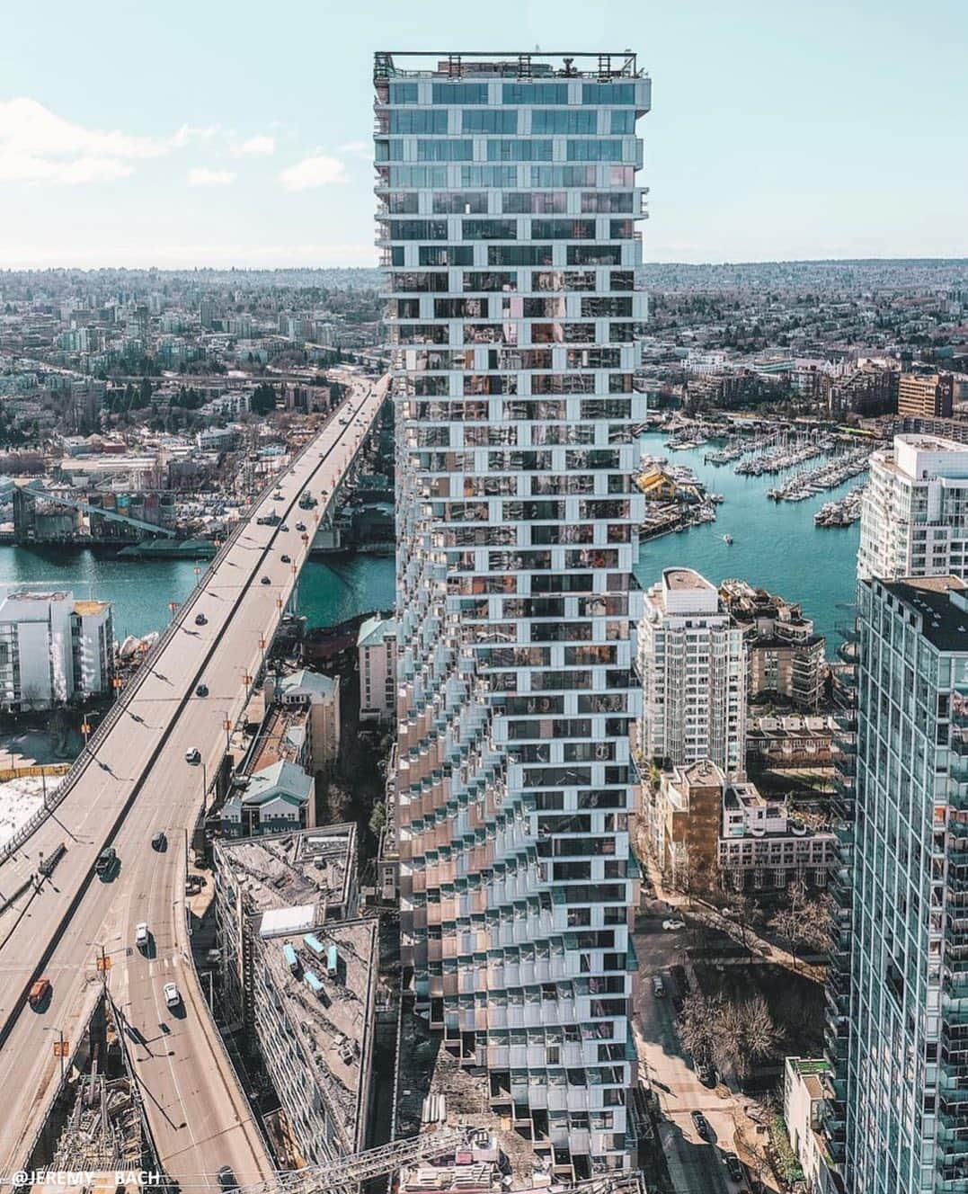TED Talksのインスタグラム：「As you drive over the Granville bridge into downtown Vancouver, this is the building that welcomes you to the Canadian city. Architect Bjarke Ingels built it right where the bridge triforks, and his goal was to create a landmark that serves as a gateway, that feels like you’re pulling a curtain back to reveal someplace magical. Part of the reason for the building’s top-heavy shape is that Bjarke only had a tiny, triangular plot of land to work with. So, he decided to build upwards 100-feet and use air space to add back some of the width. To see more futuristic architecture, watch his #TEDTalk at go.ted.com/vancouverhouse  Photo courtesy of @bjarkeingels」