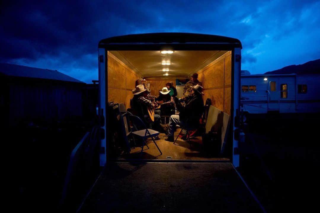 National Geographic Travelさんのインスタグラム写真 - (National Geographic TravelInstagram)「Photo by @amivitale | Cowboys gather to play music in a trailer after a long day of herding cattle in Southwestern Montana. Ranching is tough business with most working 14-16-hour days during calving season. Spurred by growing consumer concern over meat's environmental impact and their own concern about the long-term viability of their livelihood, a cohort of ranchers apply the understanding gleaned from the science of ecology to livestock management. Follow @amivitale for more photos of this incredible world and the people who inhabit it. #montana #outwest #bigskycountry #music」6月19日 20時08分 - natgeotravel