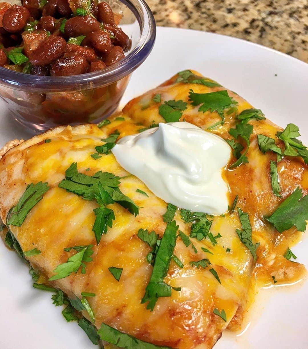 Flavorgod Seasoningsさんのインスタグラム写真 - (Flavorgod SeasoningsInstagram)「💥Back home and back to cooking. Tonight’s dinner is Sour cream Chicken Enchiladas (no tortilla/deli rollup style).﻿ -﻿ Made with:﻿ 👉 #flavorgod Taco Tuesday﻿ -﻿ On Sale here ⬇️﻿ Click the link in the bio -> @flavorgod﻿ www.flavorgod.com﻿ -﻿ -﻿ By: Customer @ketogalsara﻿ -﻿ 🔹Recipe🔹﻿ 💥1 1/2 cup shredded chicken﻿ 💥thick sliced deli chicken or turkey .﻿ 💥1/2 cup sour cream .﻿ 💥1/3 cup chunky picante sauce﻿ 💥1 tbs @flavorgod Taco Tuesday .﻿ 💥crumbled Colby/Monterey Jack cheese﻿ 💥Medium Red Enchilada sauce (check labels. They vary greatly by brand)﻿ —————————————————﻿ 🔥Mix chicken, sour cream, picante and taco seasoning in pan on stove until heated and well combined..﻿ 🔥Spoon chicken mixture onto deli meat and sprinkle a small amount of cheese inside.﻿ 🔥Pour a small amount of enchilada sauce in bottom of baking dish﻿ 🔥put rolled up enchiladas in pan seam side down. Top with additional enchilada sauce and cheese. .﻿ .🔥 Cook 375° for 15-20 minutes or until cheese is well melted. Top with sour cream and cilantro and enjoy. ———————————————-﻿ Beans are 1 net per half cup. I mixed in chunky salsa, lime juice and cilantro and chilled it before serving. Soooo good. .﻿ ———————————————— 🏷 tag a friend who needs to make these 🏷﻿ -﻿ #food #foodie #flavorgod #seasonings #glutenfree #mealprep  #keto #paleo #vegan #kosher #breakfast #lunch #dinner #yummy #delicious #foodporn ﻿」6月21日 9時00分 - flavorgod