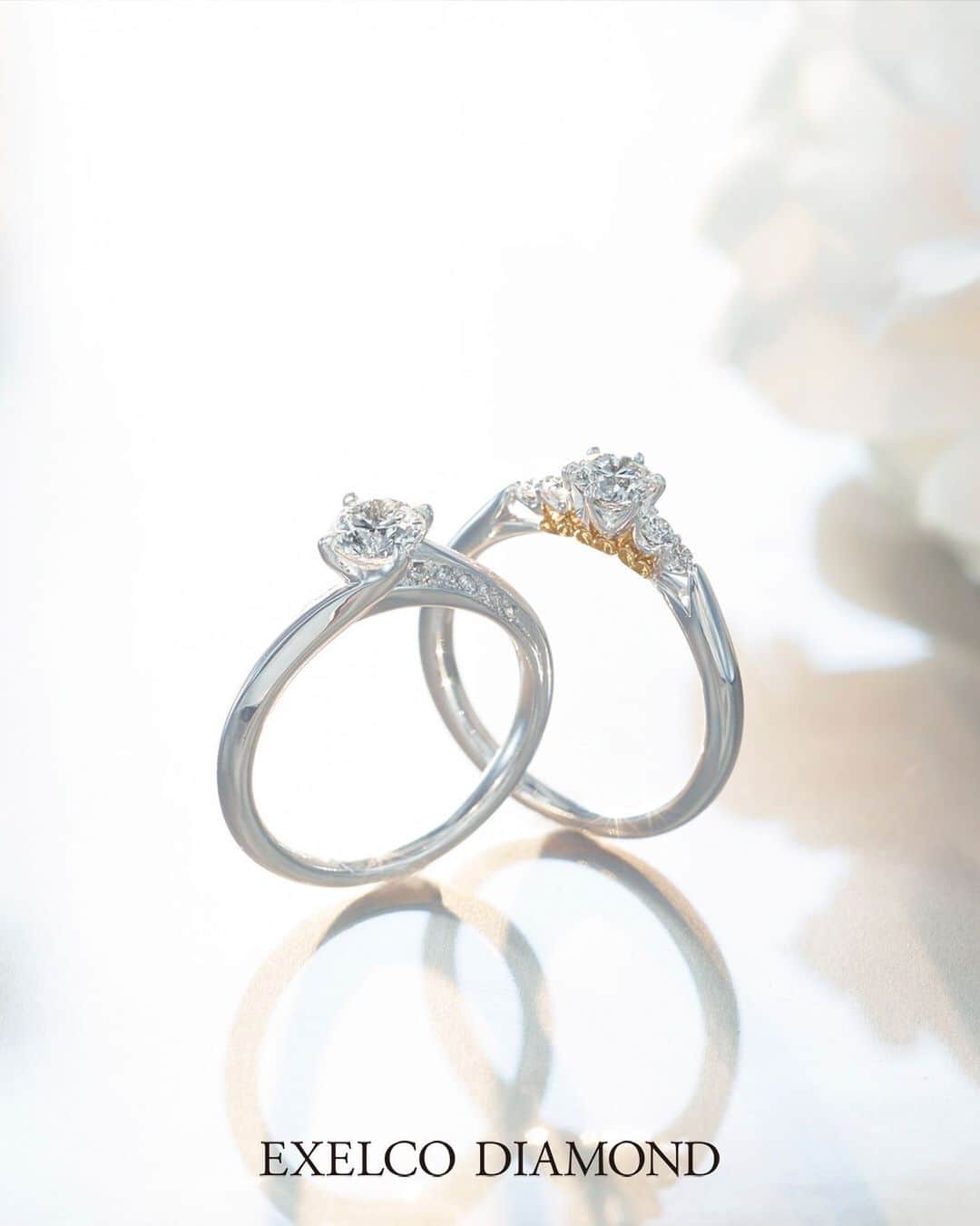 エクセルコ ダイヤモンド 婚約指輪♔結婚指輪のインスタグラム：「. EXELCO DIAMOND Engagement Ring Collection💎  左:Chance Eternelle〝シャンスエターナル〟リングのラインに沿って繋がるメレダイヤモンドの上にセンターのダイヤモンドが輝きます。 税抜 320,000円〜  右:Ensemble〝アンサンブル〟 人生を共にする2人の旋律がひとつになることを表す、プラチナとイエローゴールドのコンビネーションがサイドに。 税抜 310,000円〜  他にも多数ご用意しております。公式HPをご覧ください。 * 店舗一覧 東京本店/盛岡店/仙台店/新潟店/青山店/町田マルイ店/横浜店/みなとみらい店/大宮店/ 宇都宮店/高崎店/静岡店/浜松店/金沢店/長野店/松本店/名古屋本店/大阪店/ 梅田店/京都店/神戸店/広島店/福岡店/ヒルトン福岡シーホーク店/小倉店/博多店/長崎ハマクロス411店/熊本店 * #エクセルコダイヤモンド　#exelcodiamond * *」