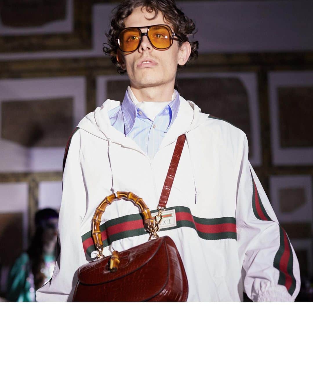 のインスタグラム：「Bamboo, used as a handle of handbags by #Gucci since the 40s, features in a bag crafted in crocodile leather over a hooded anorak with the House Web stripe, in the #GucciCruise20 fashion show by @alessandro_michele.  @museiincomuneroma #AlessandroMichele #MuseiCapitolini See a video of the collection through link in bio.」