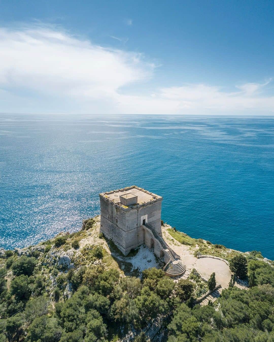 National Geographic Travelさんのインスタグラム写真 - (National Geographic TravelInstagram)「Photo by @andrea_frazzetta | An aerial view of Torre dell’Alto, a watchtower that overlooks the Ionian Sea in the middle of the beautiful bay of Porto Selvaggio. Porto Selvaggio is a Natural Park along the Ionian coast of Salento, the southern part of Puglia, the heel in Italy's boot. The park is a mixture of high and scenic cliffs, fresh pine forests and Mediterranean bush. To see more photos from my travels, follow me @andrea_frazzetta #salento #italy #dronephotography」6月2日 15時59分 - natgeotravel