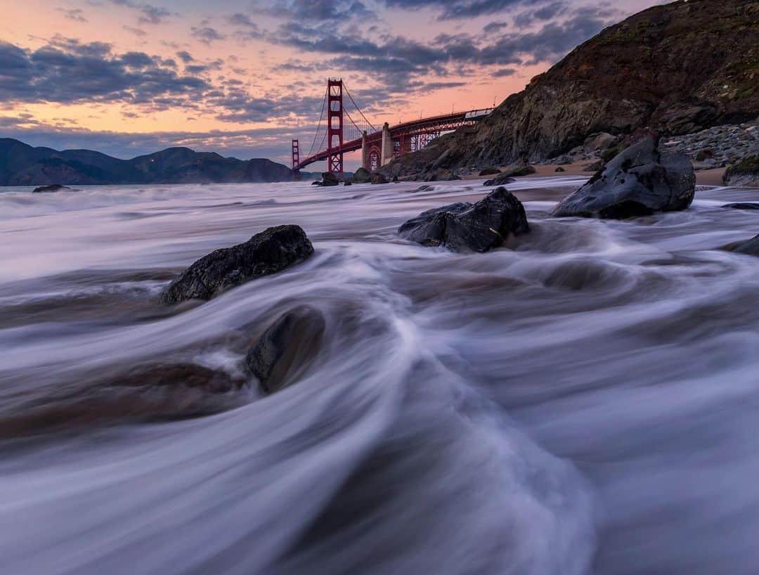 CANON USAさんのインスタグラム写真 - (CANON USAInstagram)「"Capturing the sunset at my favorite beach in San Francisco with the Golden Gate Bridge in the background. This particular evening, the tide had some really nice movements around the rocks with a pleasant bit of moody color in the sky." #MyCanonStory  Photo Credit: @JC.Liang Camera: #Canon EOS 6D Lens: EF 16-35mm f/2.8L USM Aperture: f/11 ISO: 100 Shutter Speed: 0.6 sec Focal Length: 16mm」6月3日 22時05分 - canonusa