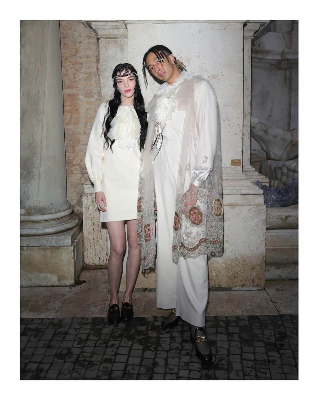 グッチさんのインスタグラム写真 - (グッチInstagram)「@ghali and @iosonomariacarlaboscono together at the #GucciCruise20 fashion show held at Rome’s Capitoline Museums @museiincomuneroma. #Ghali wore #GucciFW19 lace cape with embroidery, shirt with lace details, leather loafers with chain Horsebit detail and a leather #GucciZumi shoulder bag. #MariacarlaBoscono wore a #GucciFW19 dress with lace details, leather Horsebit loafers and a headband with crystal studs. On her lips, she wore @GucciBeauty Rouge à Lèvres Satin shade number 402 ‘Vantine Fuchsia’. Discover more through link in bio. #AlessandroMichele #MuseiCapitolini @museiincomuneroma #GucciBeauty」6月3日 20時57分 - gucci